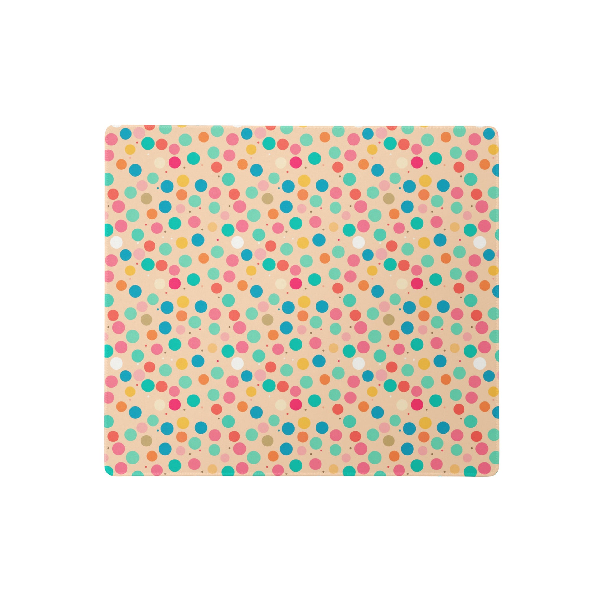 A 18" x 16" desk pad with a colorful polka dot pattern.