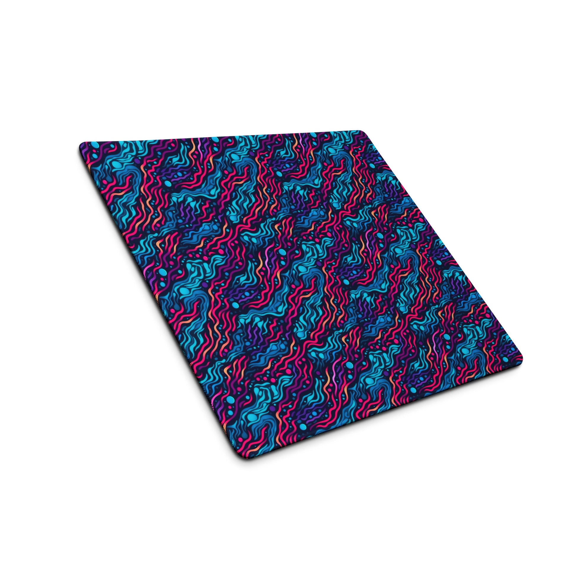 A 18" x 16" desk pad with wavy blue and pink pattern sitting at an angle.