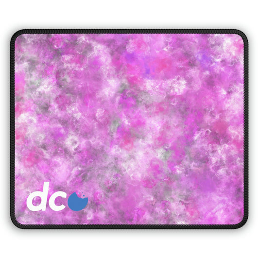 A gaming mouse pad with a fluffy mix of pink, white, and gray.
