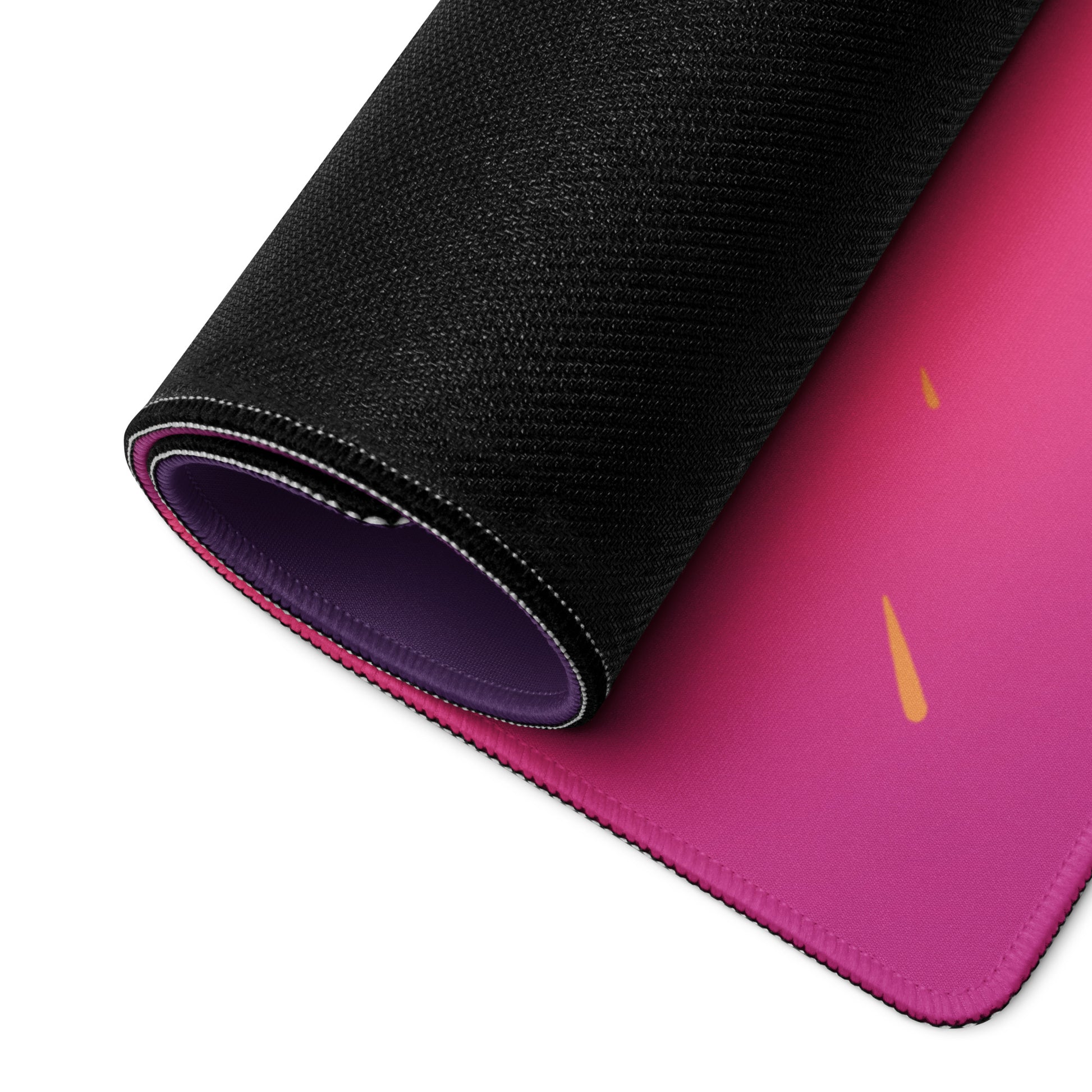 A 36" x 18" pink and purple desk pad with a futuristic samurai rolled up.