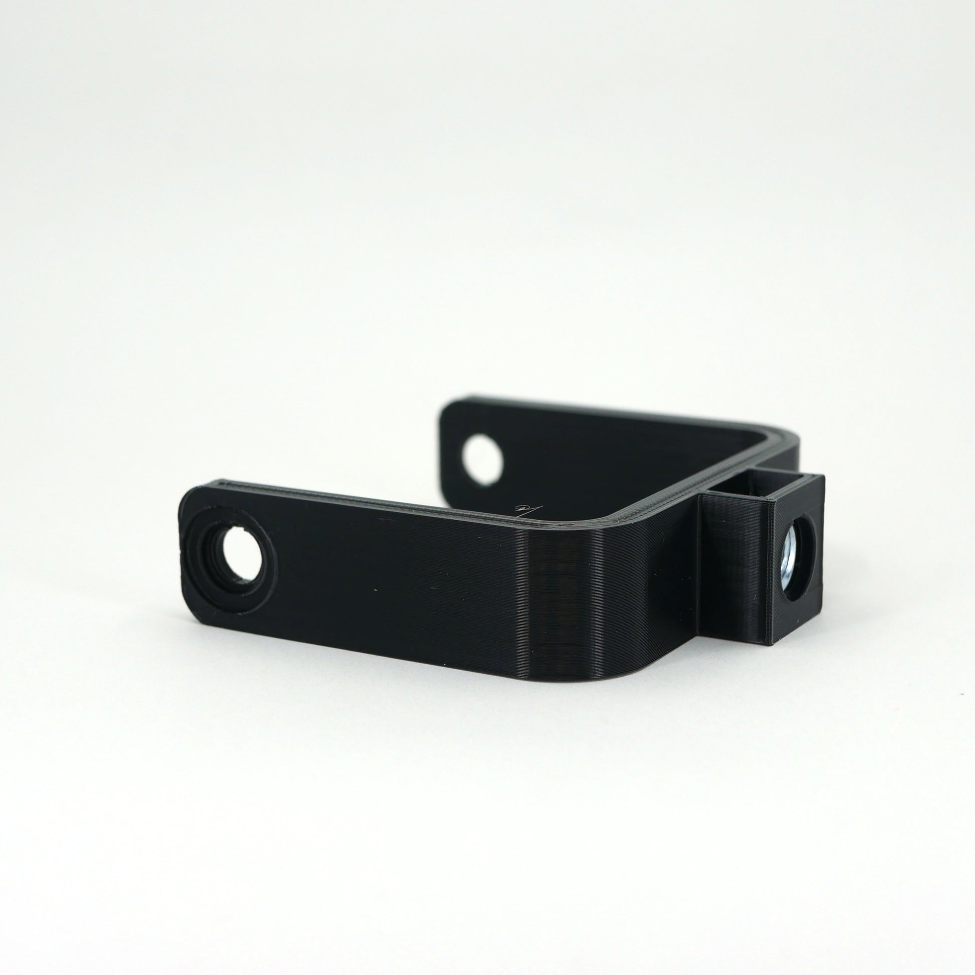 The left side of a black microphone mount for the Elgato Wave microphone.