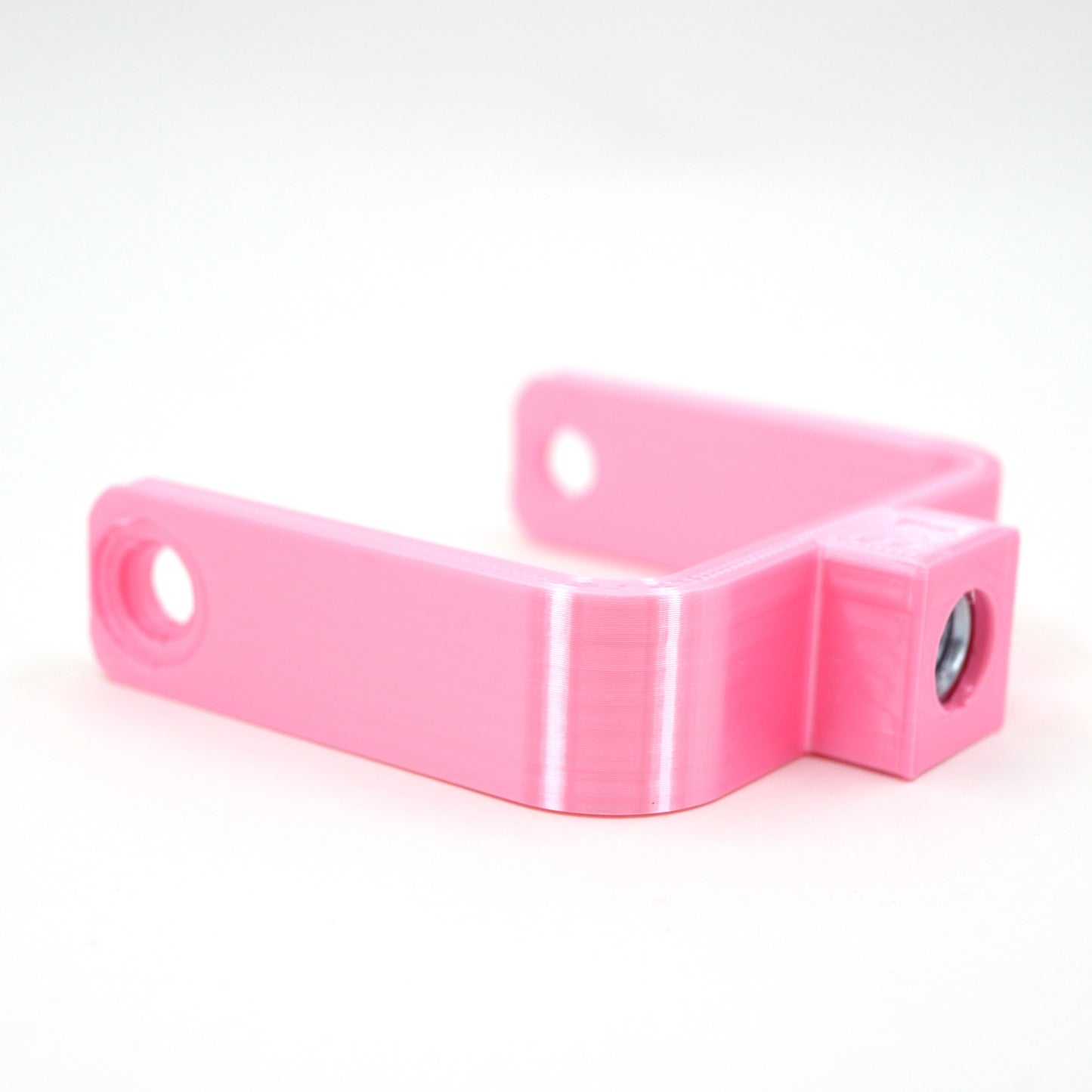 The left side of a pink microphone mount for the Elgato Wave microphone.