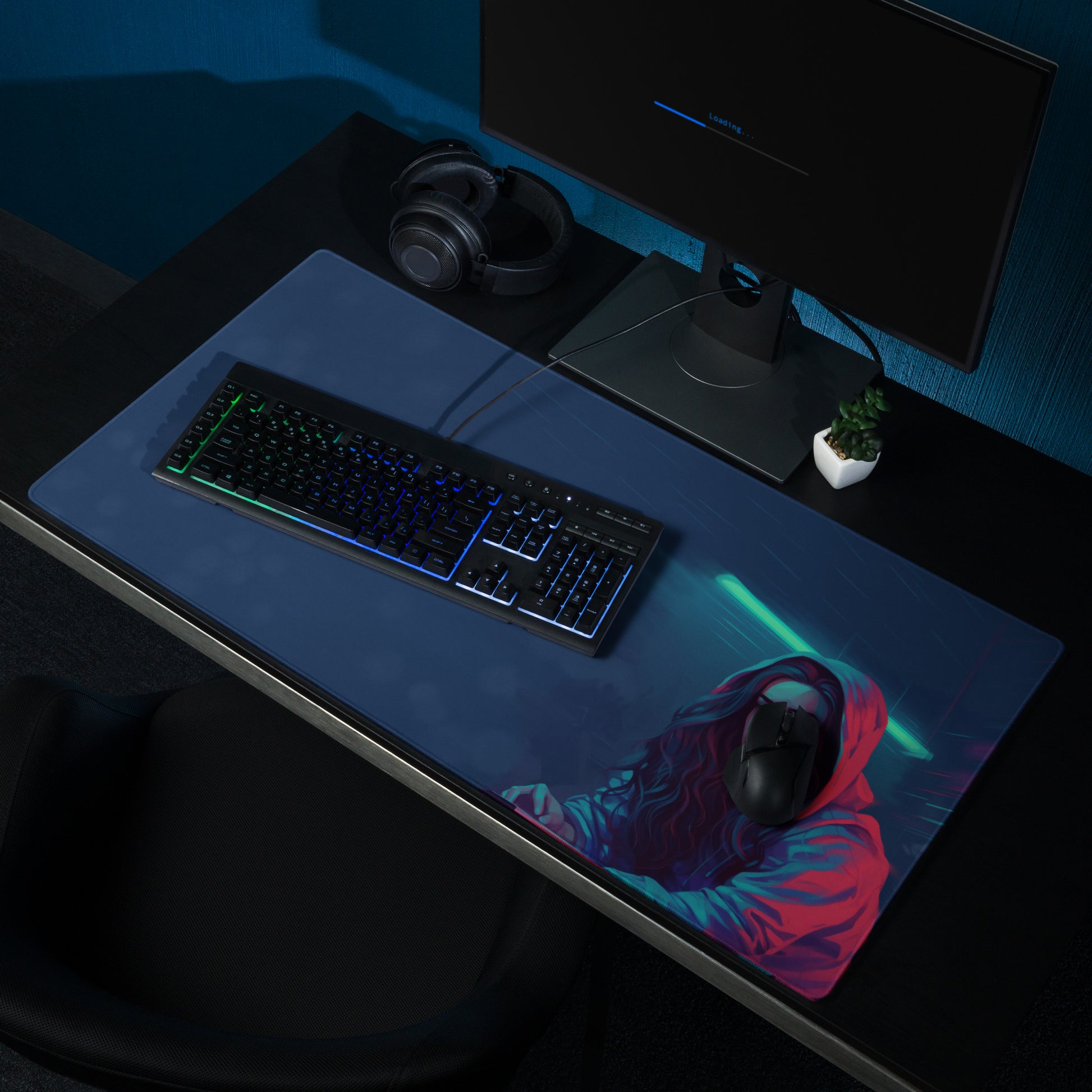 A 36" x 18" blue desk pad with a girl in a hoodie sitting on a desk.