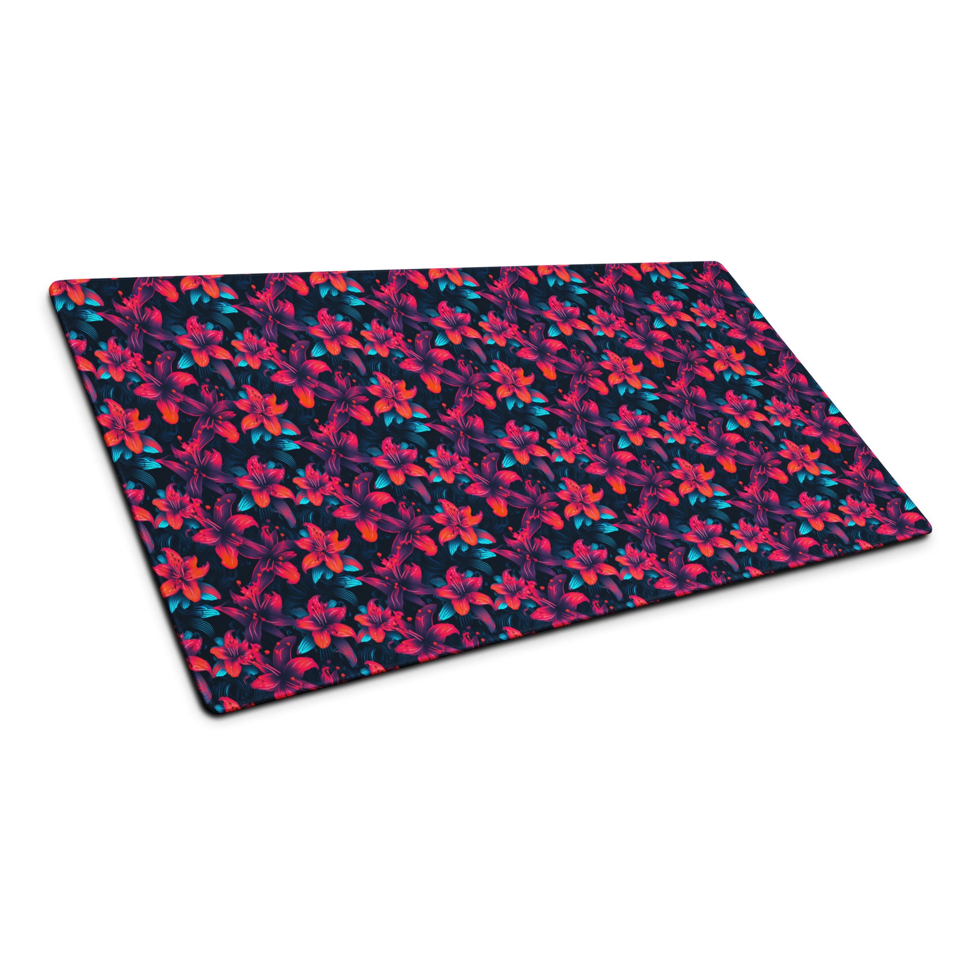 A 36" x 18" desk pad with a neon red and blue floral pattern sitting at an angle.