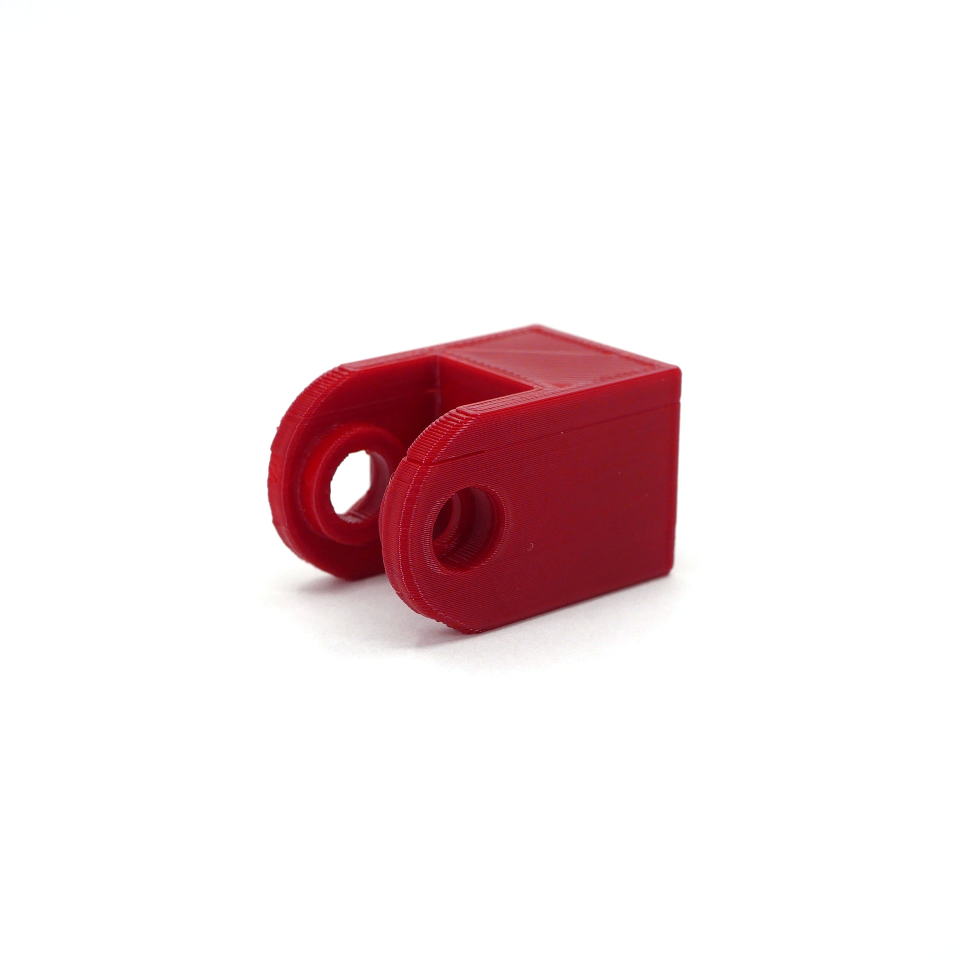 A red HyperX DuoCast microphone mount adapter.