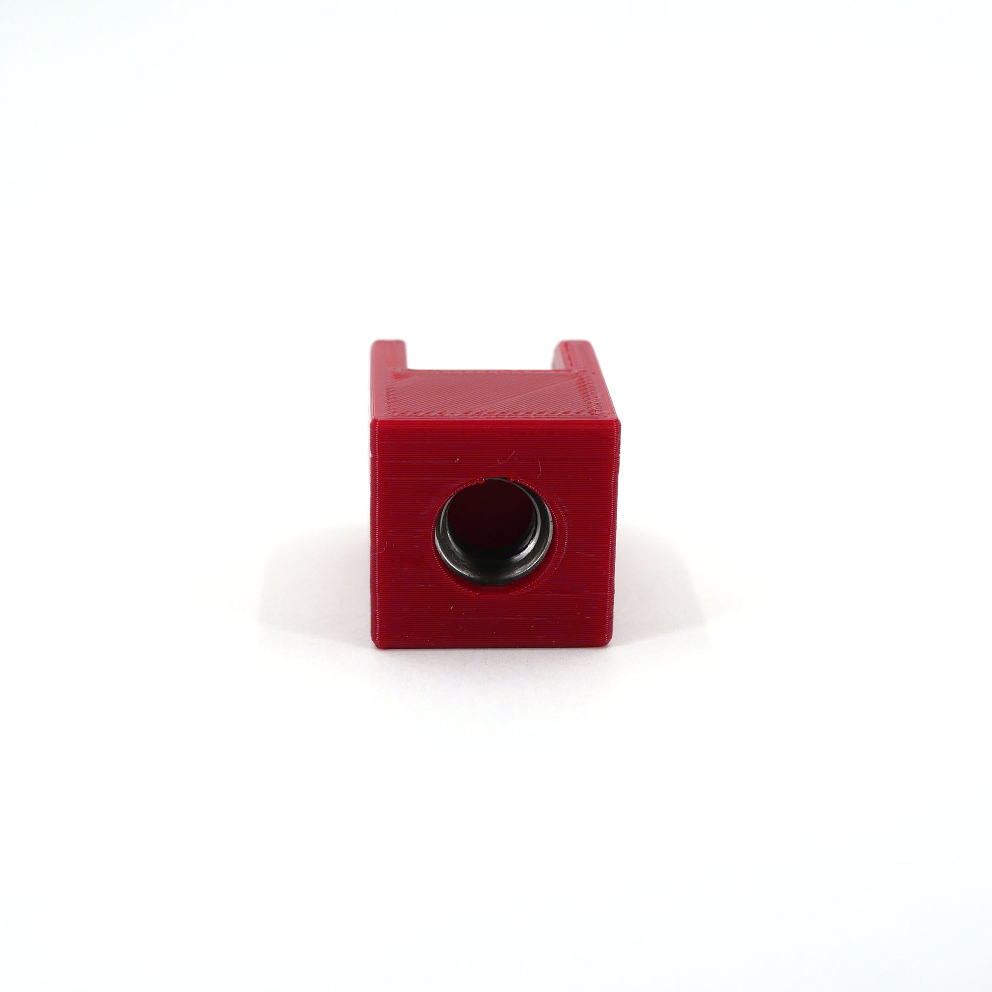 The bottom of a red HyperX DuoCast microphone mount adapter.