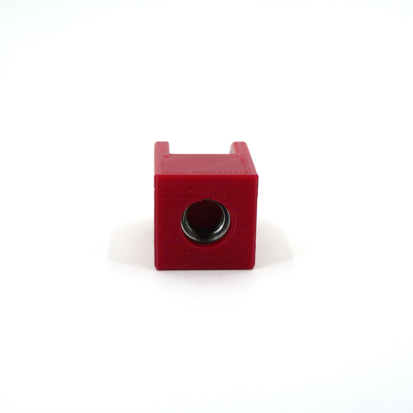 The bottom of a red HyperX QuadCast microphone mount adapter.