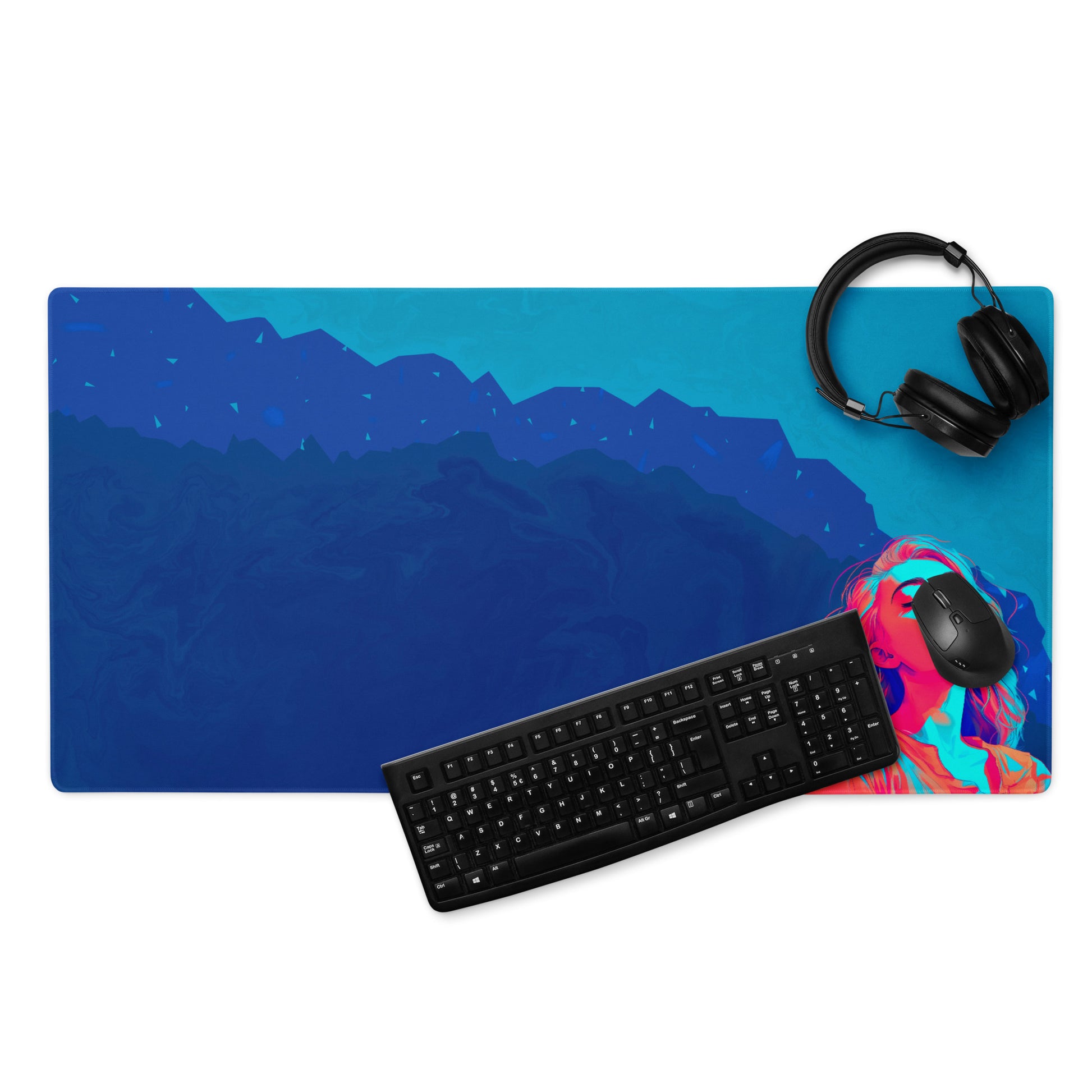 A 36" x 18" blue desk pad with a girl looking up. With a keyboard, mouse, and headphones sitting on it.