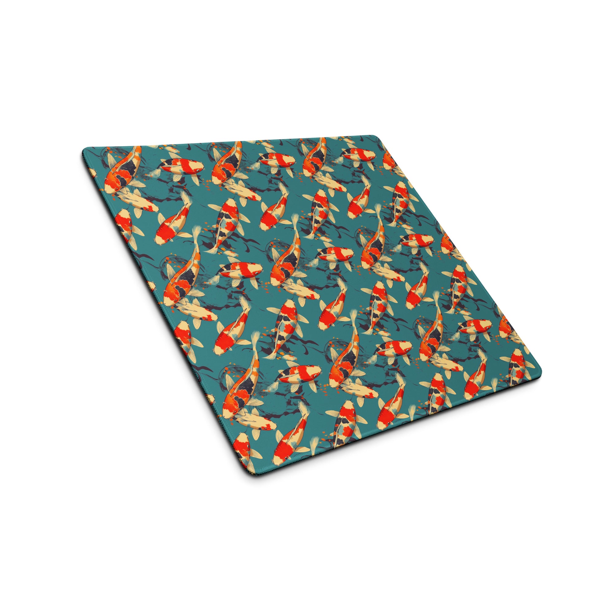An 18" x 16" gaming desk pad with red koi fish on a blue background sitting at an angle.