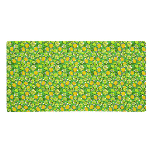 A 36" x 18" gaming desk pad with lemons and limes on a green background.