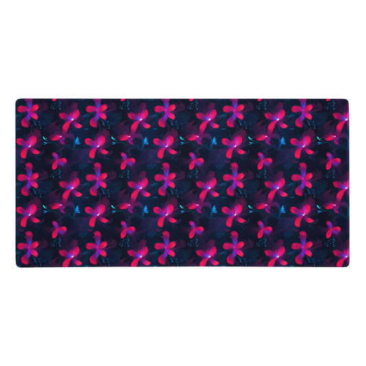 A 36" x 18" desk pad with neon pink and blue floral pattern.