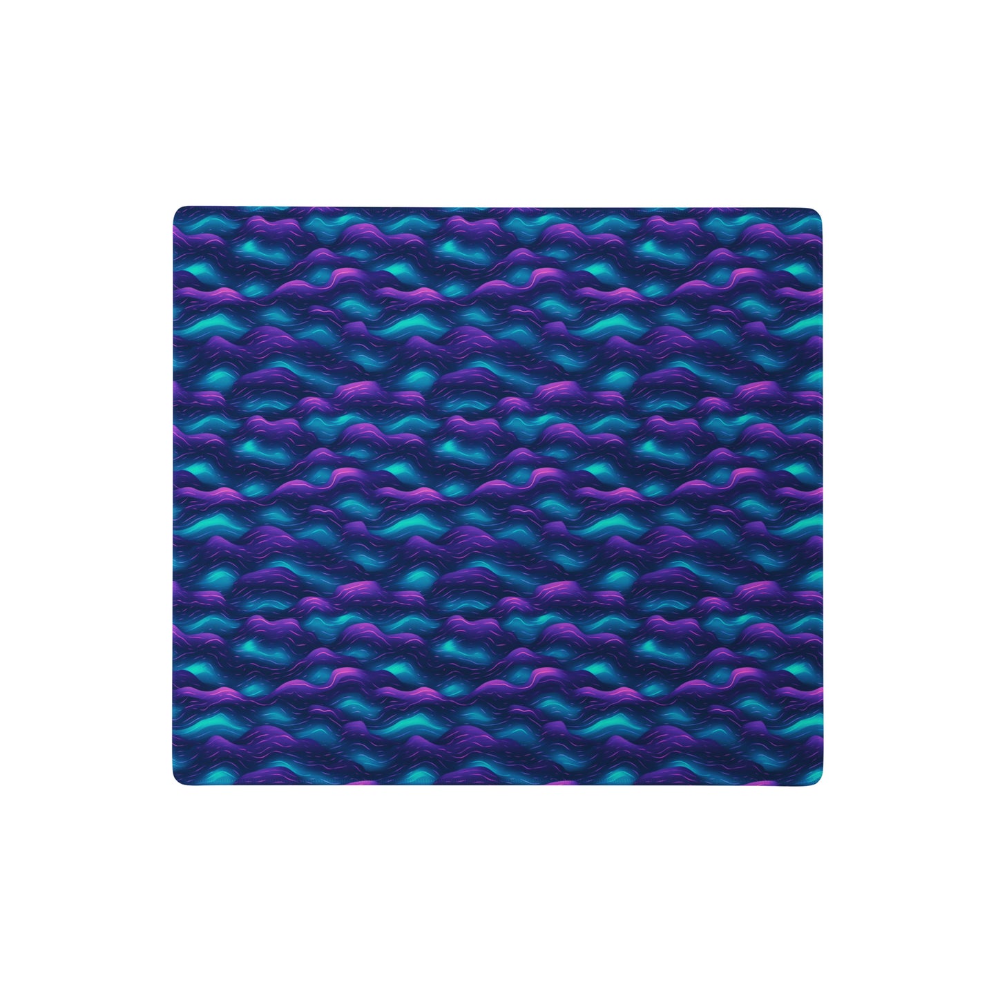 A 18" x 16" desk pad with blue and purple wave pattern.