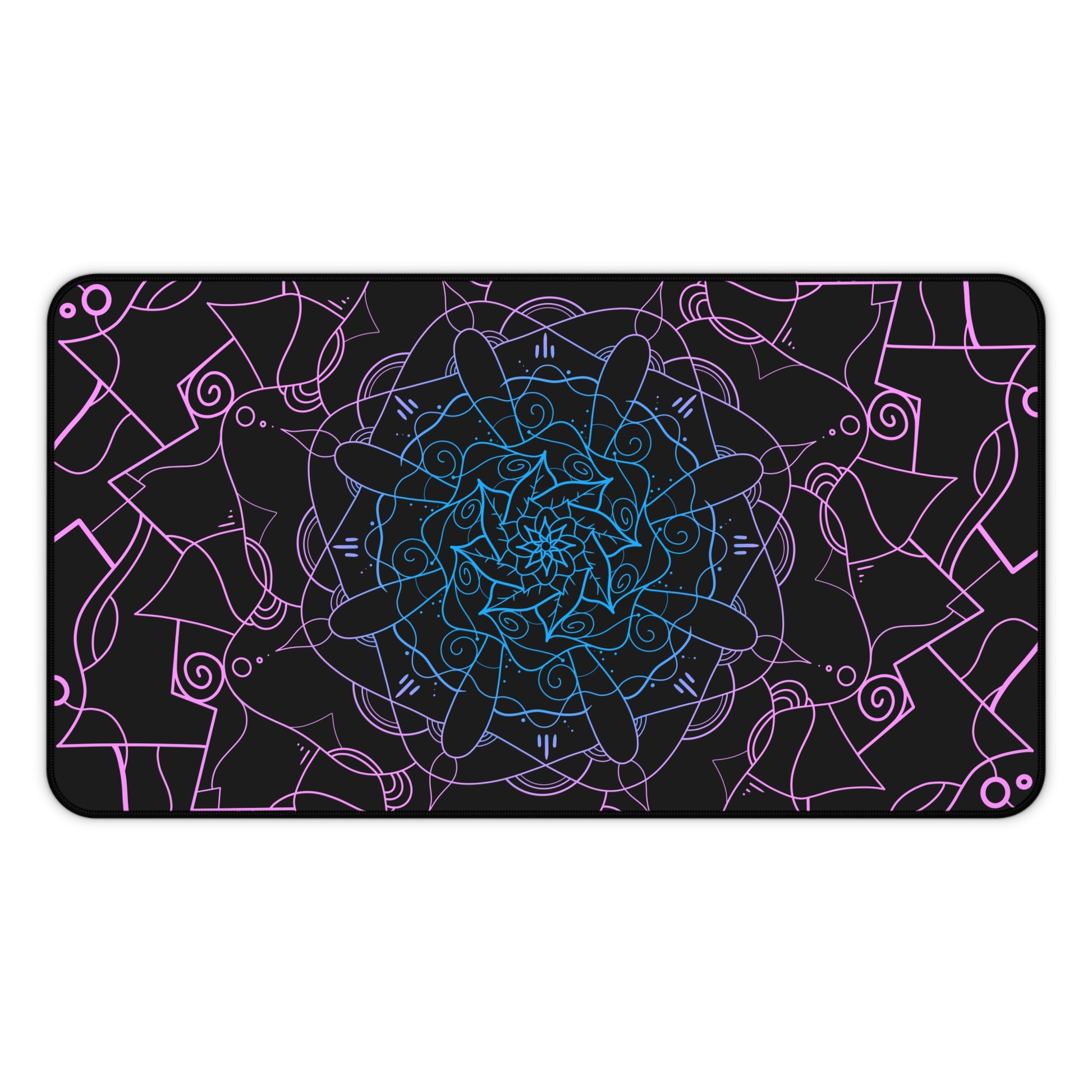 A 12" x 22" desk mat with a pink and blue mandala pattern on a black background.