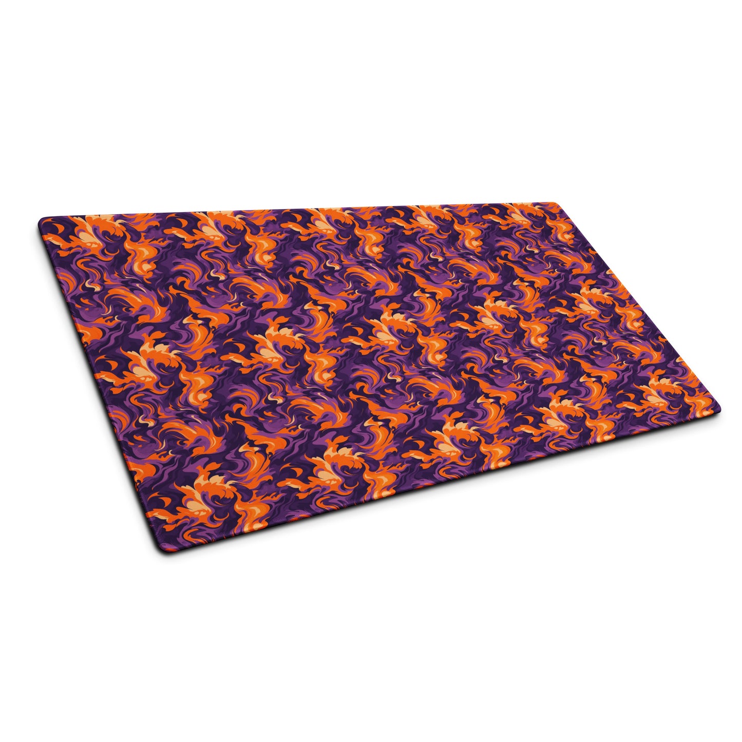 A 36" x 18" desk pad with a purple and orange camo pattern sitting at an angle.