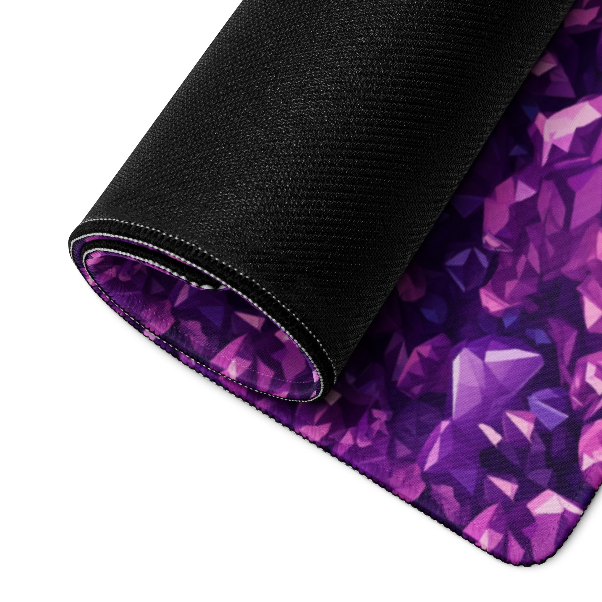 A purple crystal gaming desk pad rolled up.