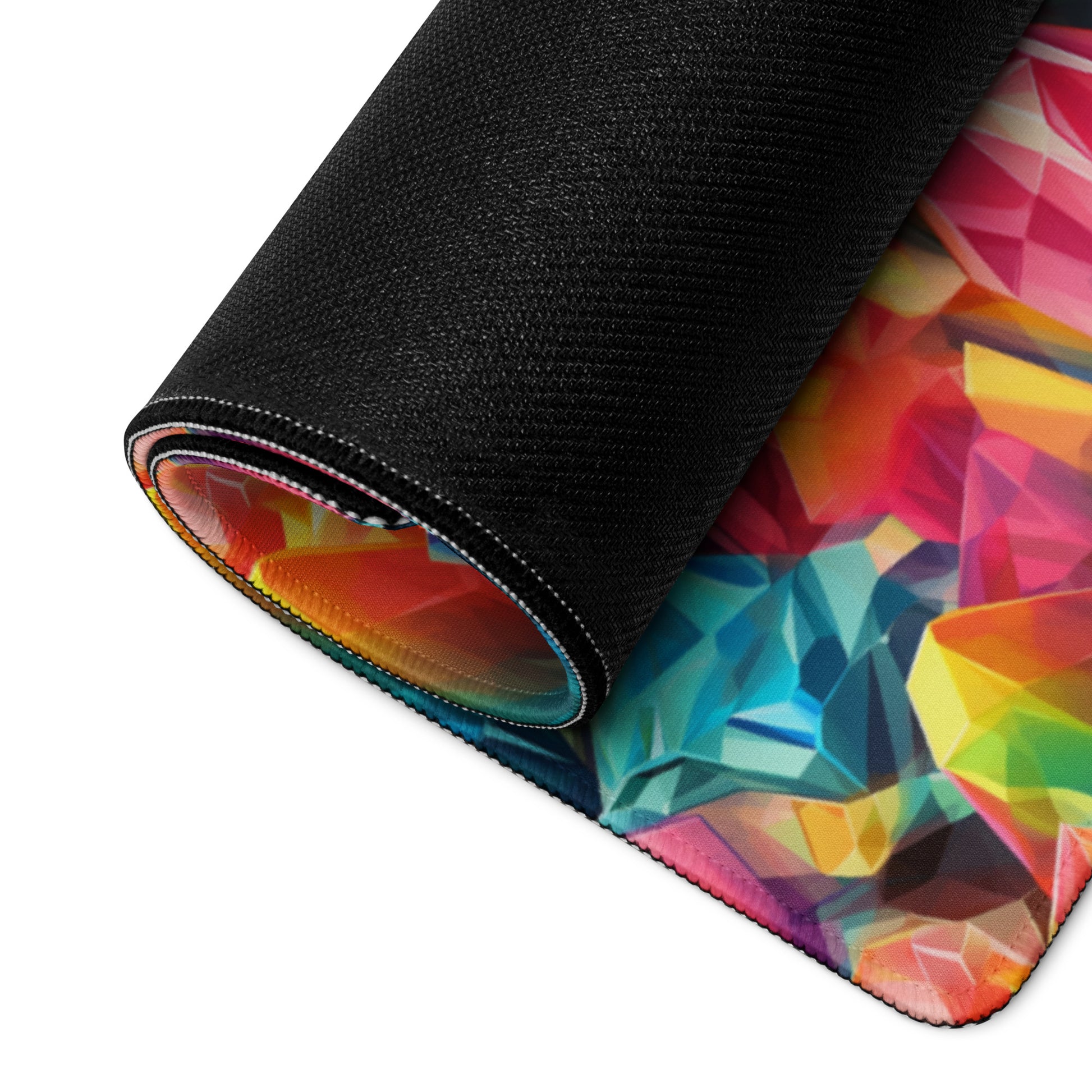 A rainbow crystal gaming desk pad rolled up.