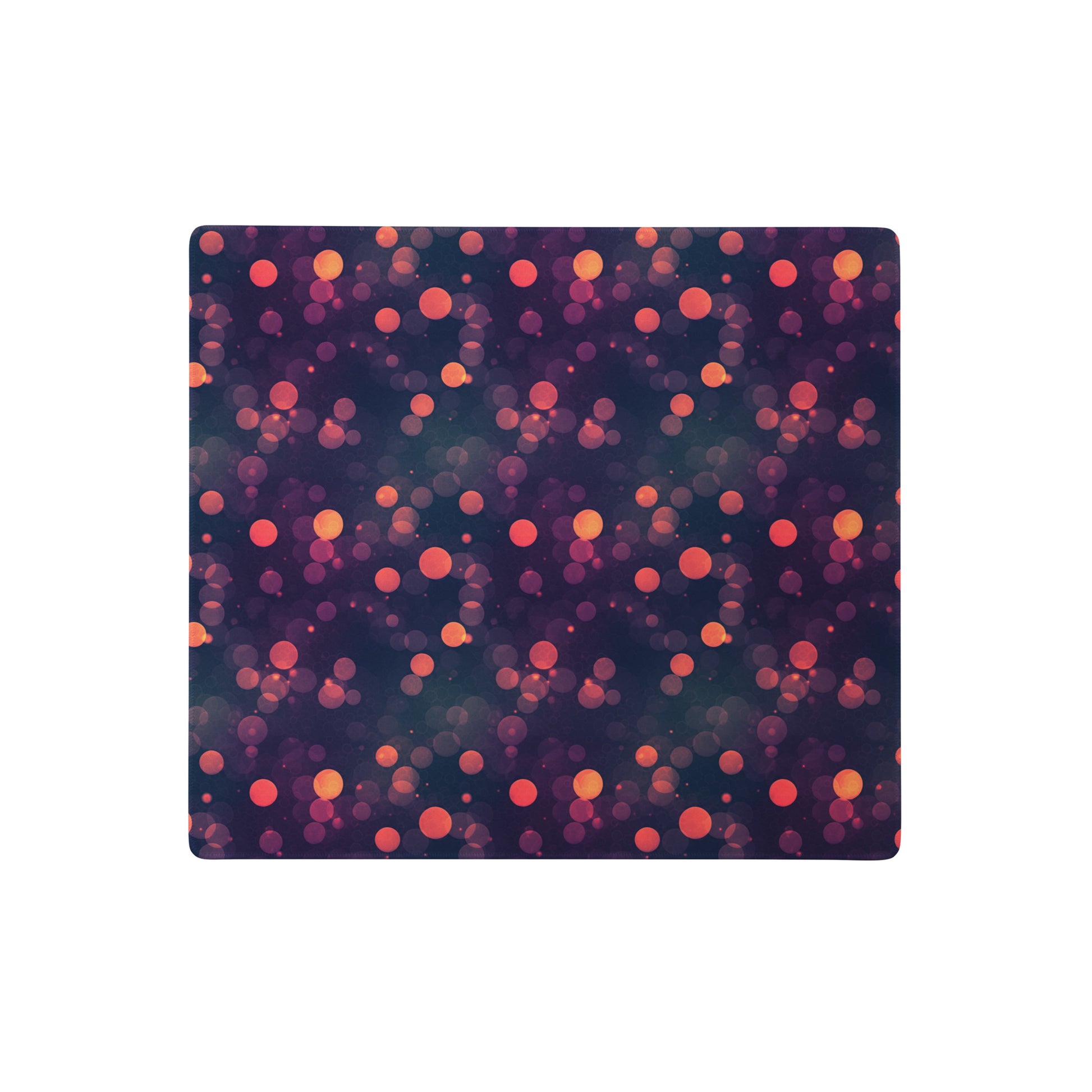 A 18" x 16" desk pad with a purple and red polka dot pattern.