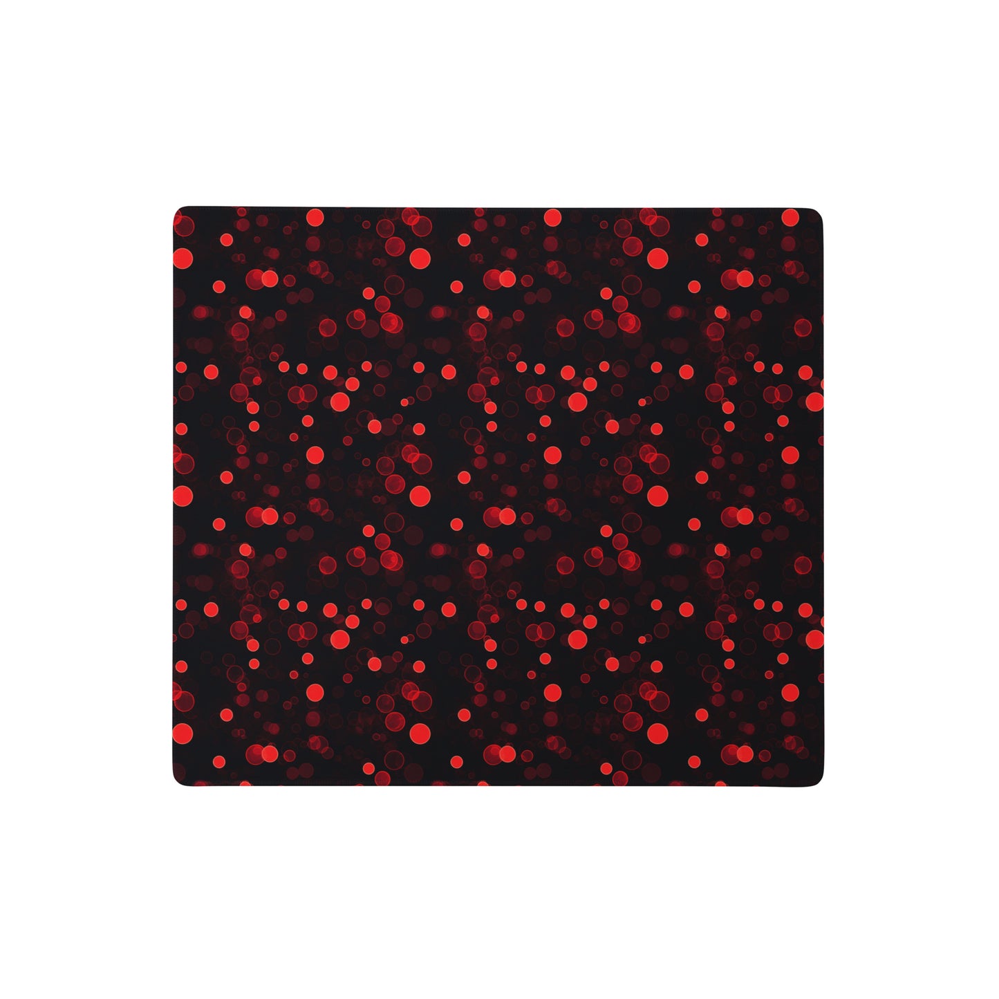 A 18" x 16" desk pad with red polka dots.