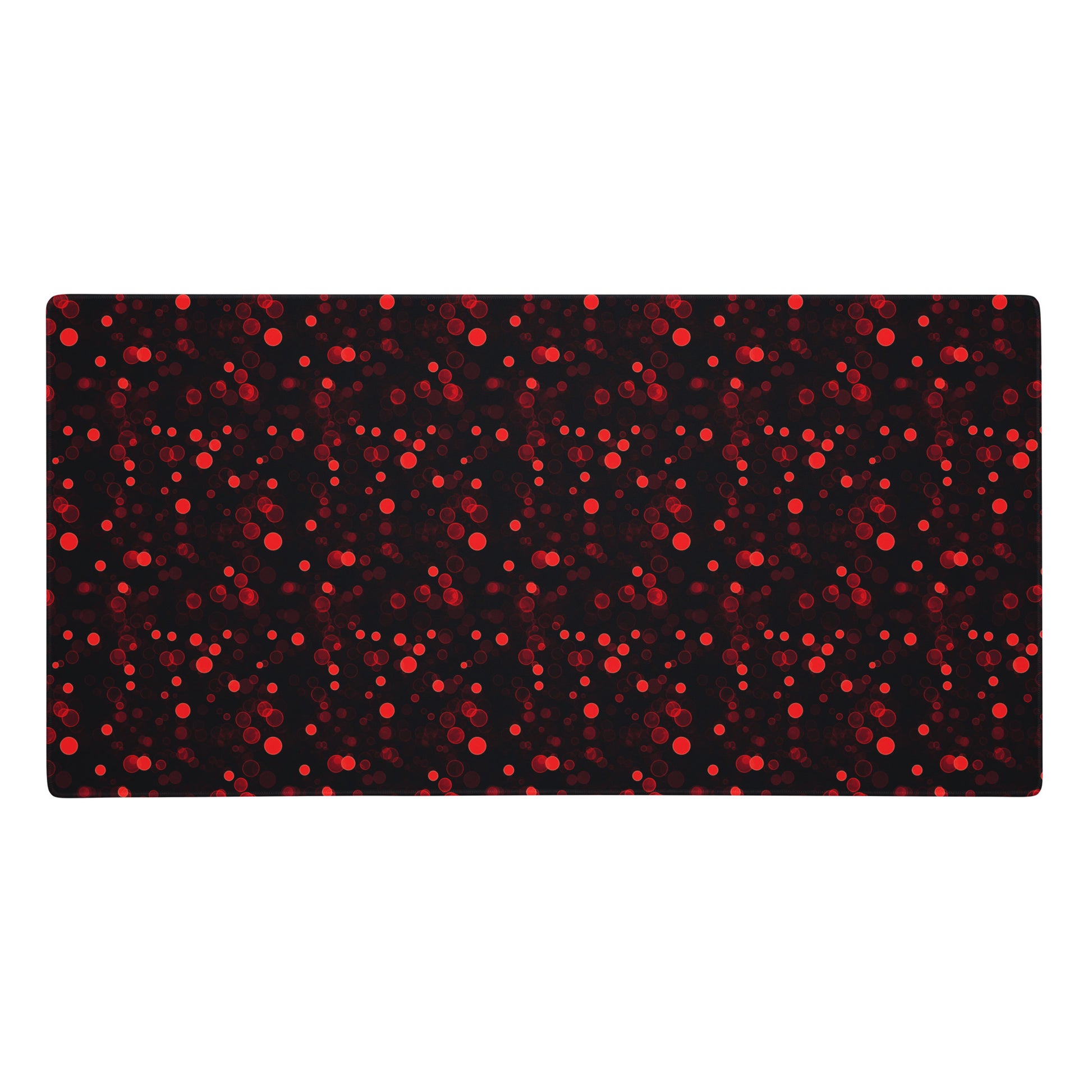 A 36" x 18" desk pad with red polka dots.