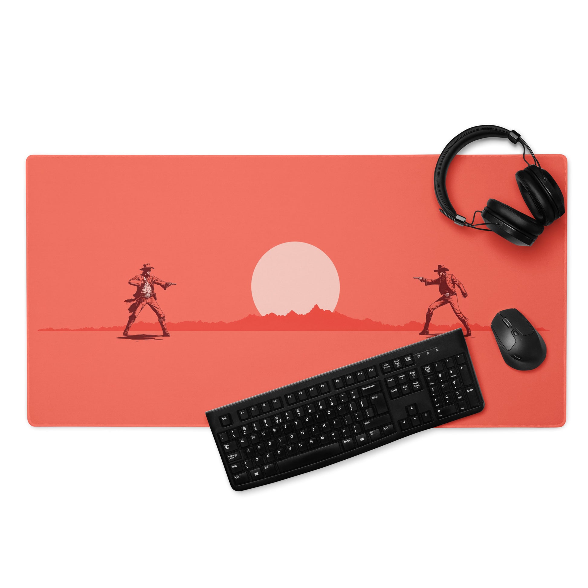 A Red 36" x 18" desk pad with cowboys dueling. With a keyboard, mouse, and headphones sitting on it.