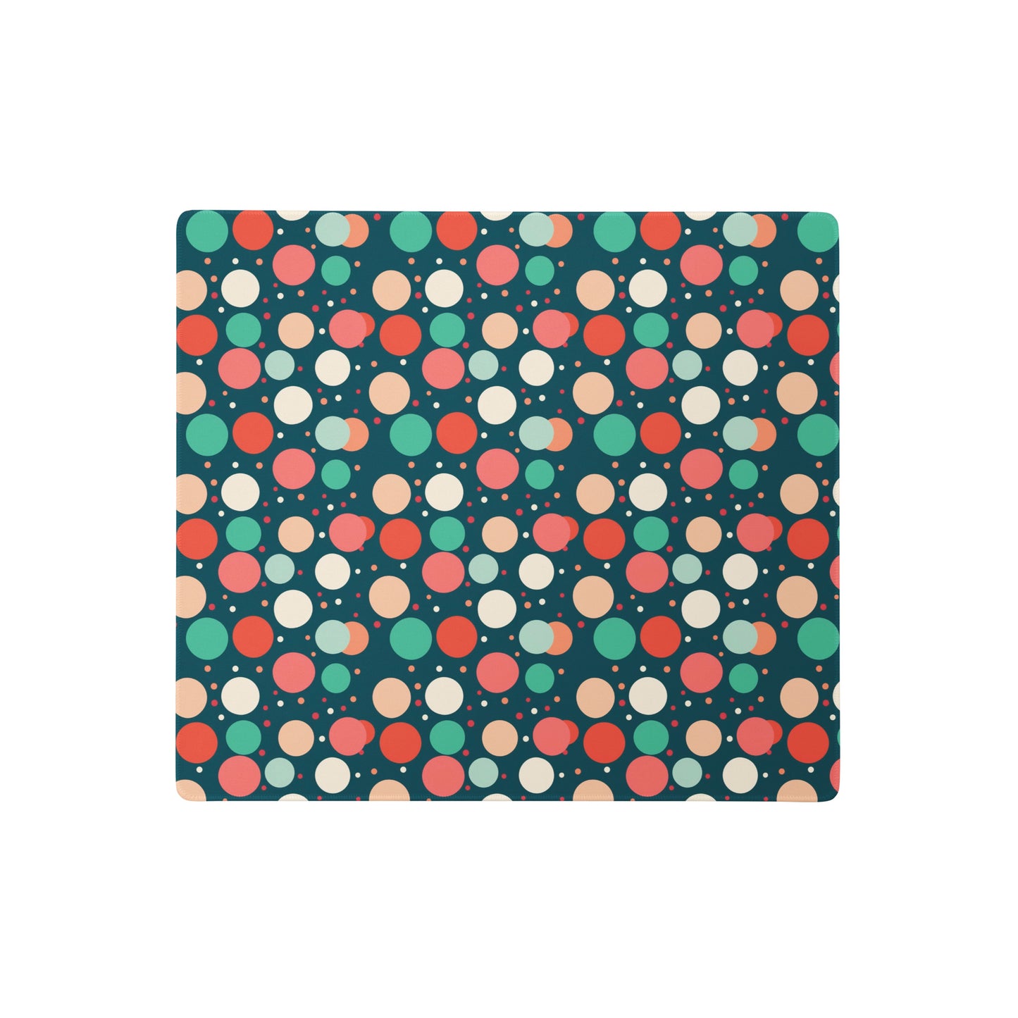  A 18" x 16" desk pad with red teal and yellow polka dot pattern.