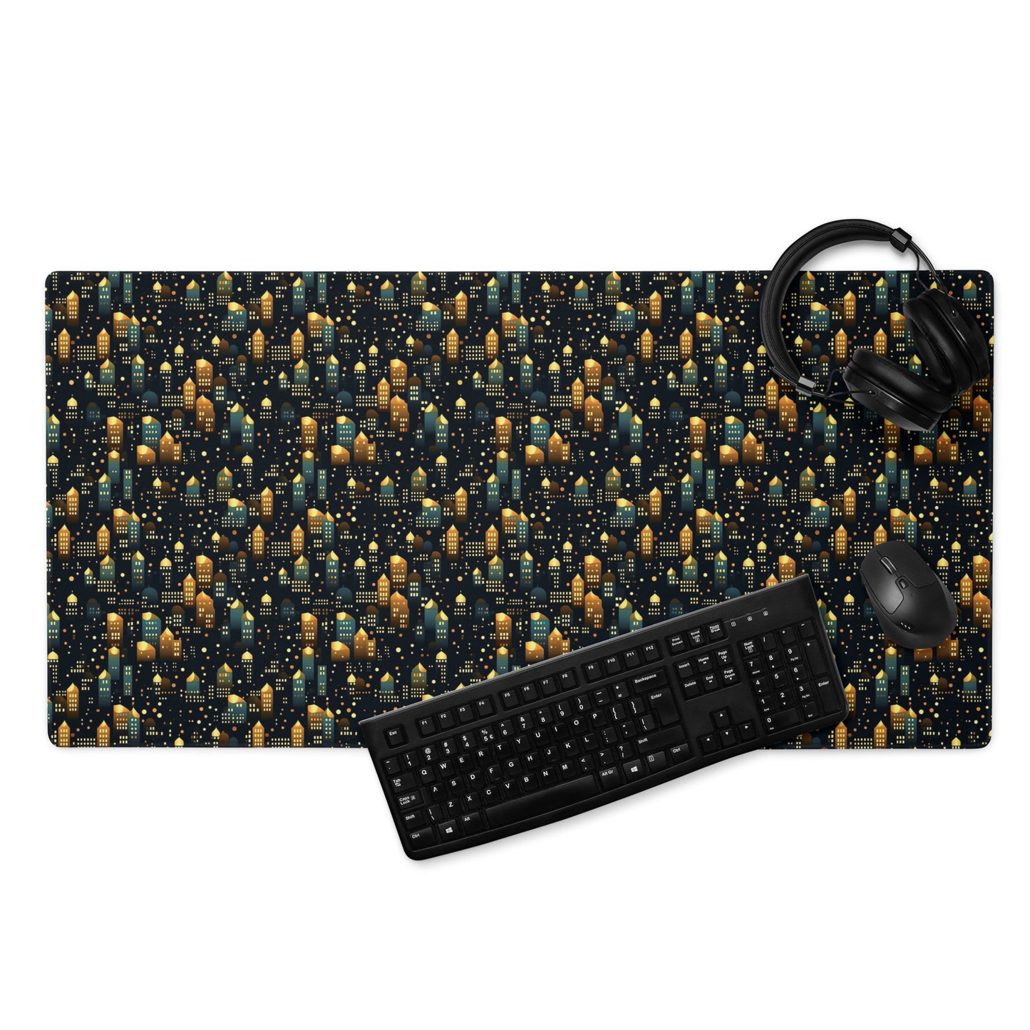 A 36" x 18" desk pad with a stary city pattern. With a keyboard, mouse, and headphones sitting on it.