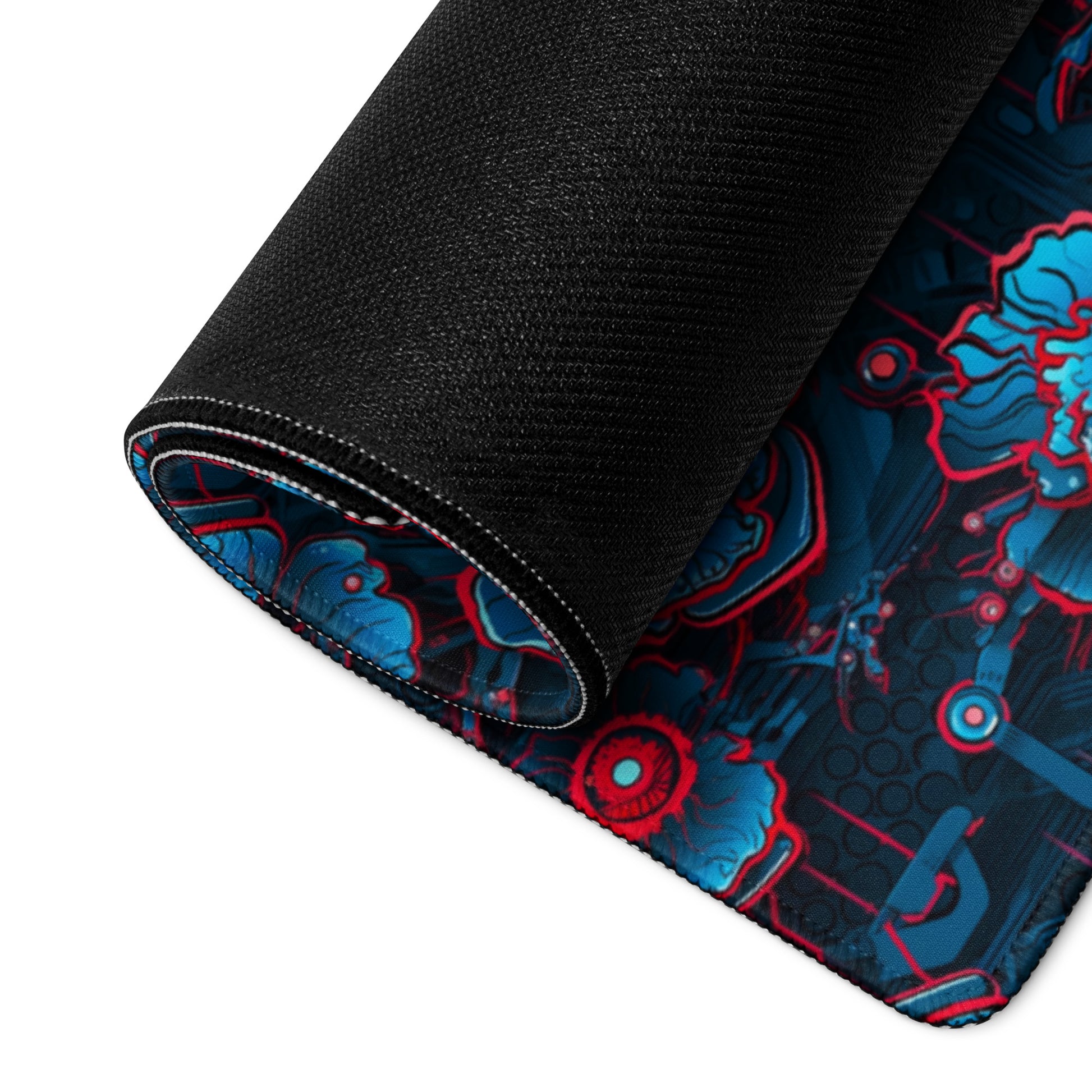 A 36" x 18" desk pad with a blue and red robotic floral pattern rolled up.