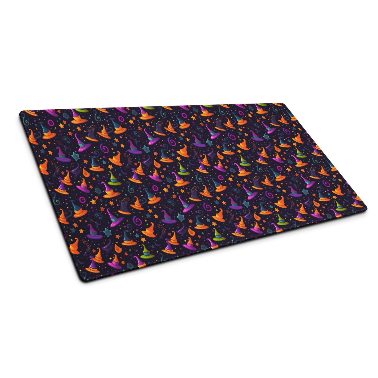 A 36" x 18" desk pad with a orange and purple wizard hat pattern sitting at an angle.