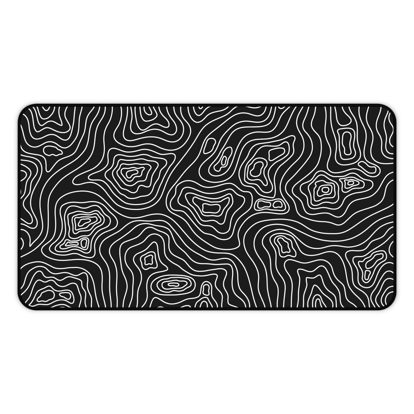 A 12" x 22" black desk mat with white topographic lines.