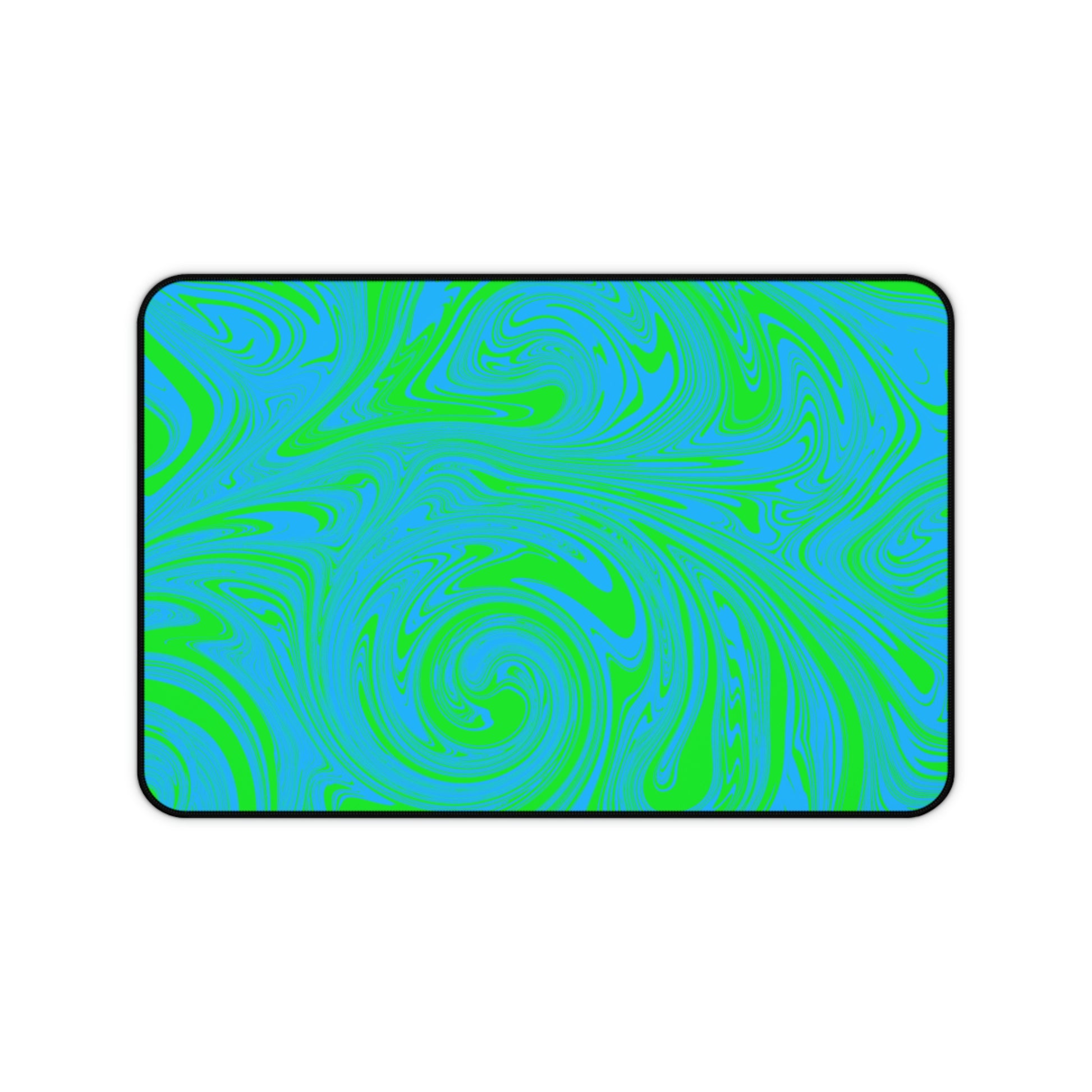 A 12" x 18" desk mat with blue and green swirls.
