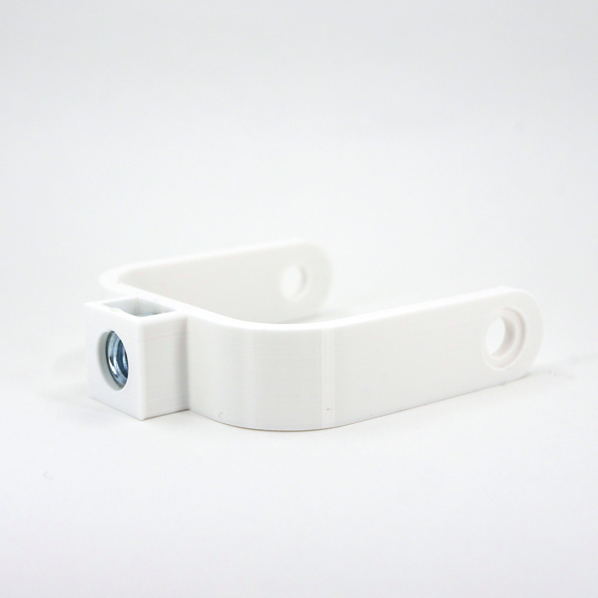 The right side of a white microphone mount for the Blue Yeti Nano microphone.