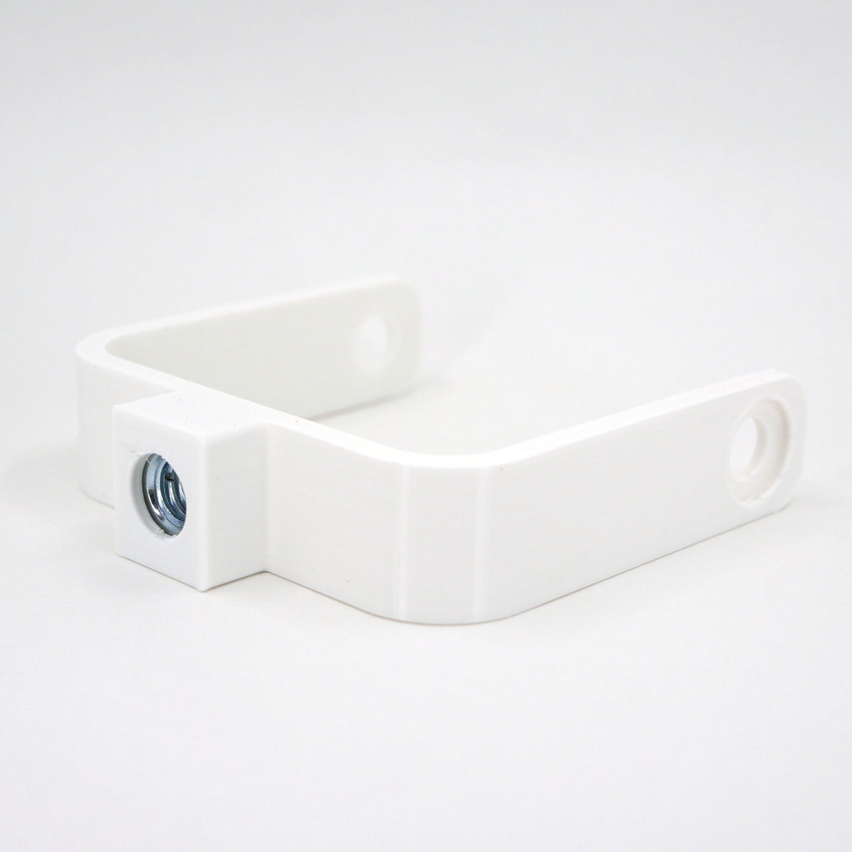 The right side of a white microphone mount for the Blue Yeti X microphone.