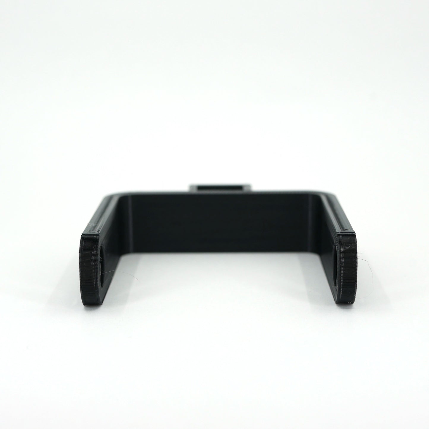 The front of a black microphone mount for the FIFINE K678 microphone.