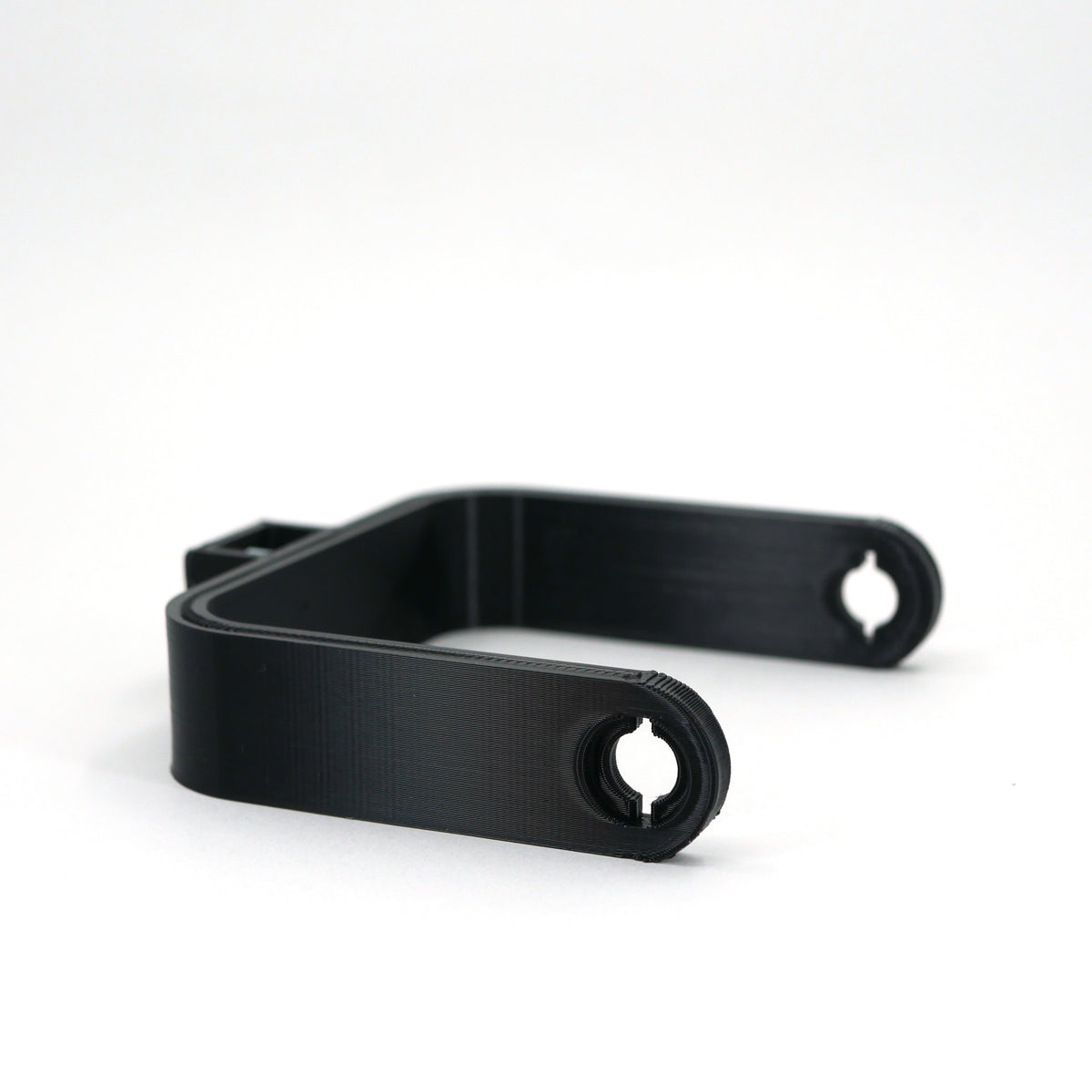 A black microphone mount for the FIFINE K690 microphone sitting at an angle.
