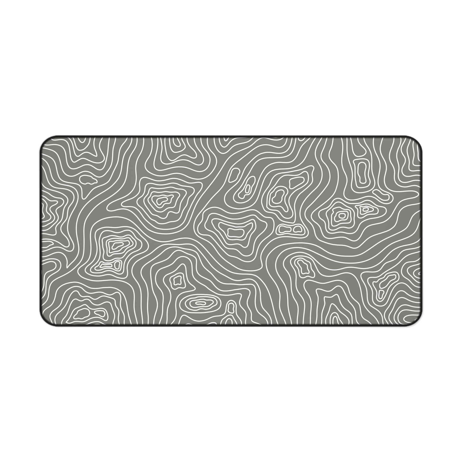 A 31" x 15.5" gray desk mat with white topographic lines.