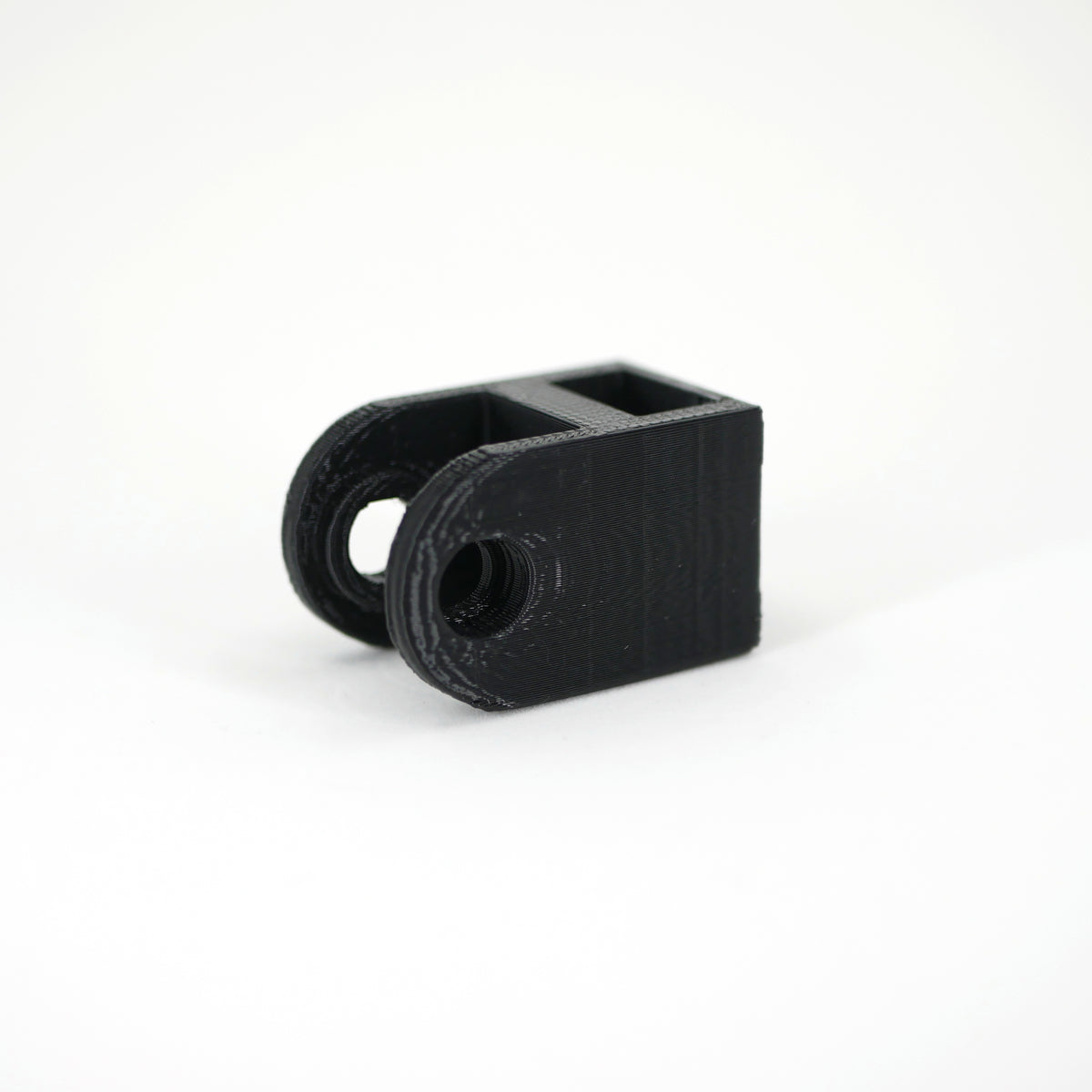 A black HyperX DuoCast microphone mount adapter.