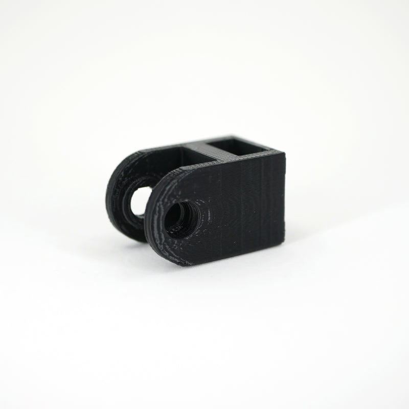 A black HyperX DuoCast microphone mount adapter.