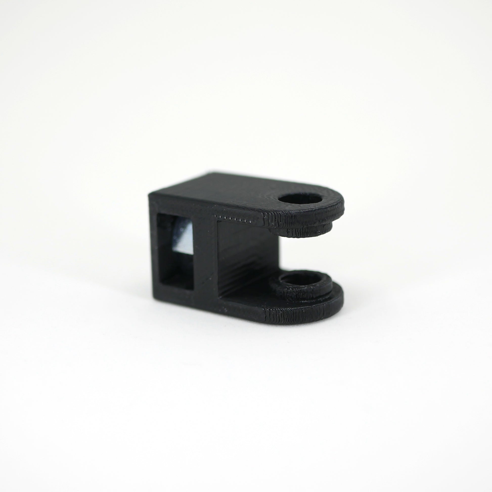 The front of a black HyperX QuadCast microphone mount adapter.