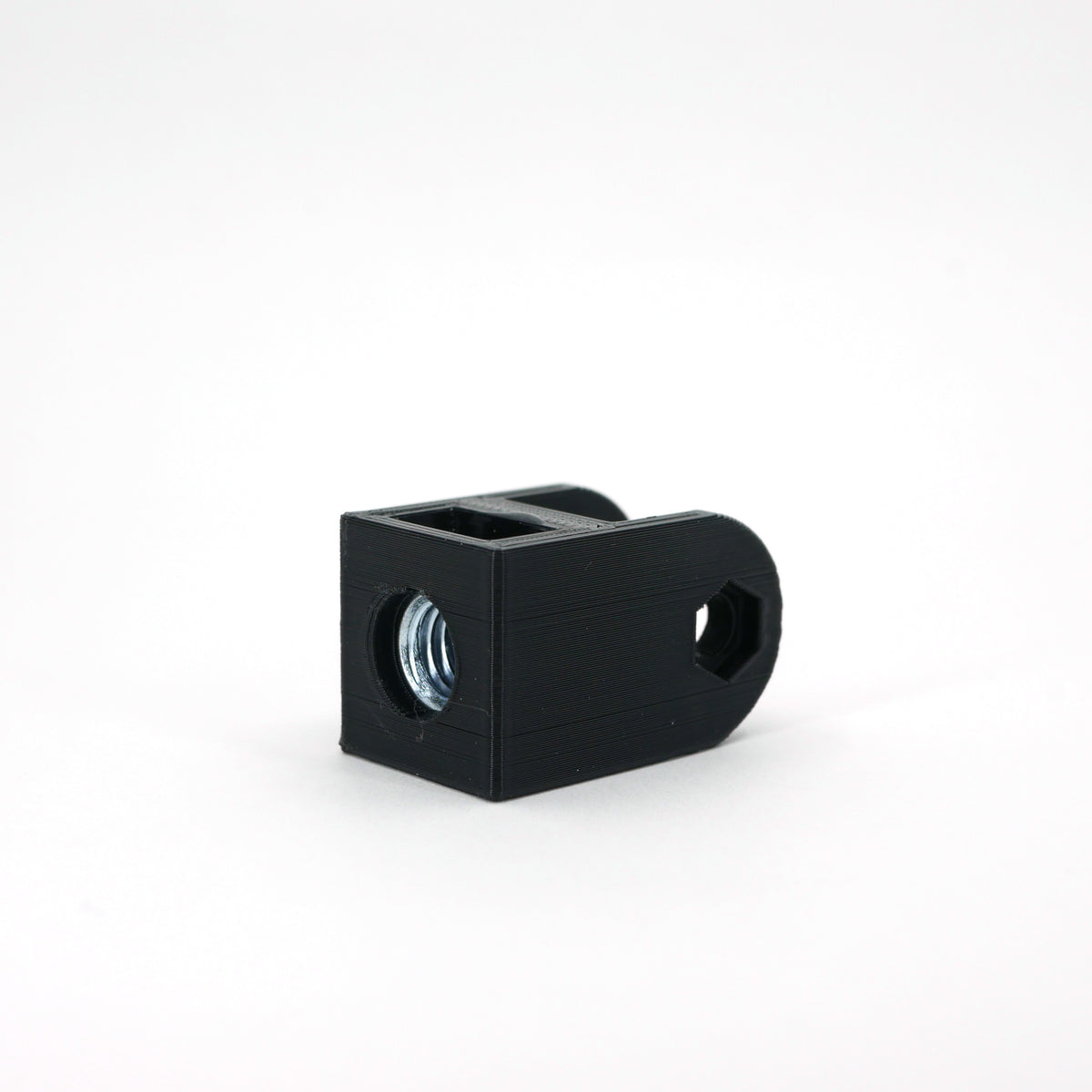 A black HyperX SoloCast microphone mount adapter sitting at an angle.