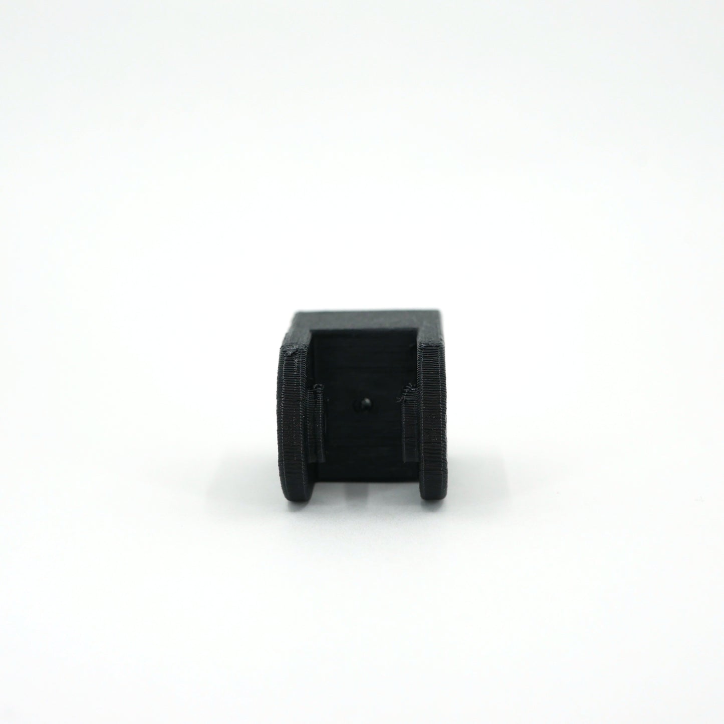 The top of a black HyperX SoloCast microphone mount adapter.
