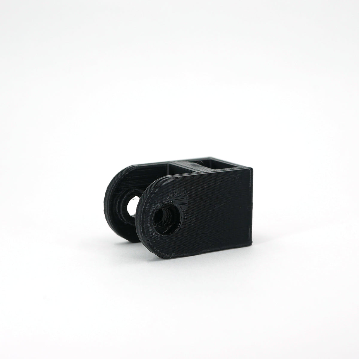 A black HyperX SoloCast microphone mount adapter.