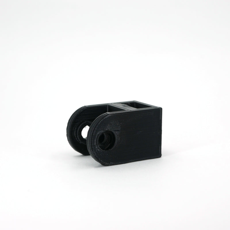 A black HyperX SoloCast microphone mount adapter.