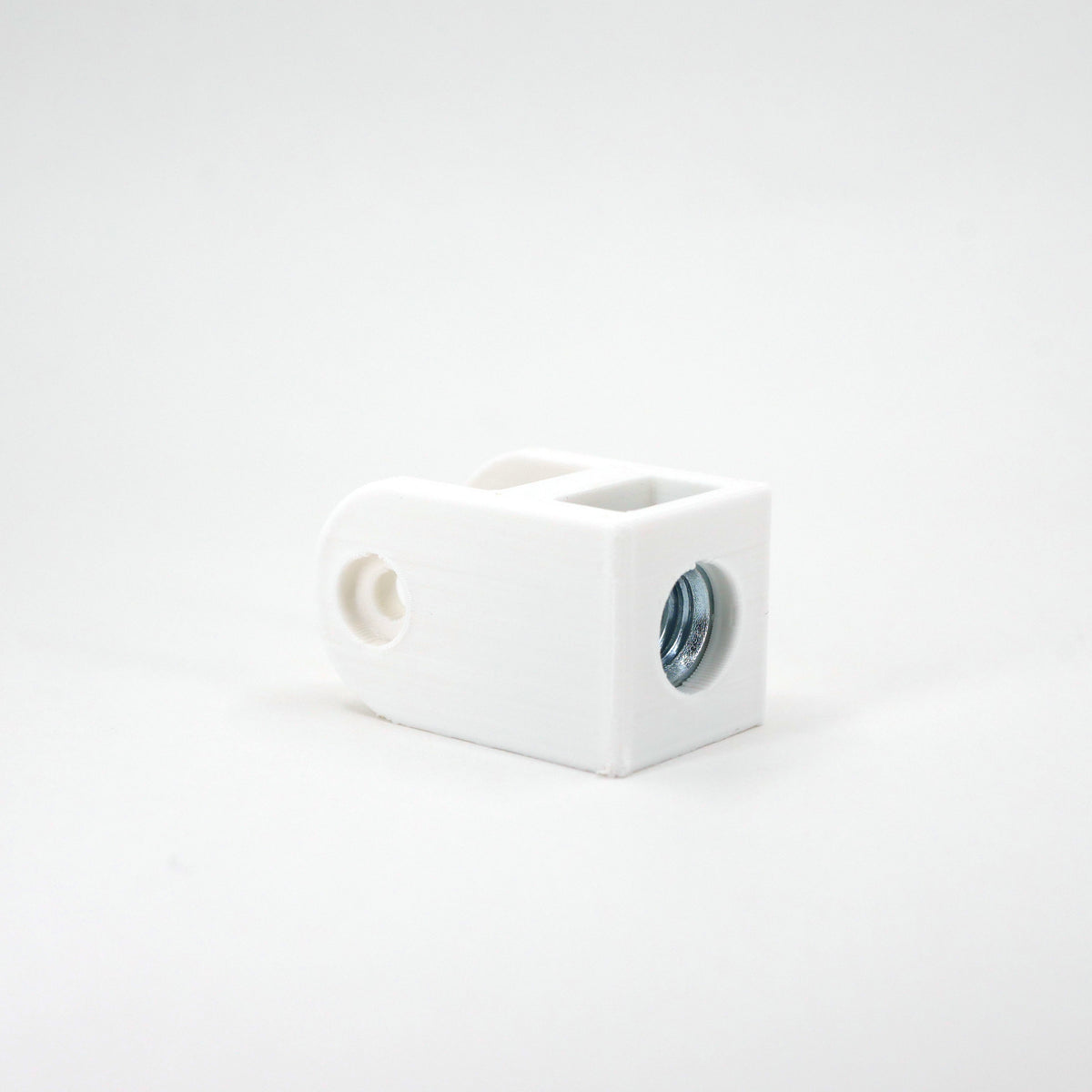 A white HyperX SoloCast microphone mount adapter sitting at an angle.