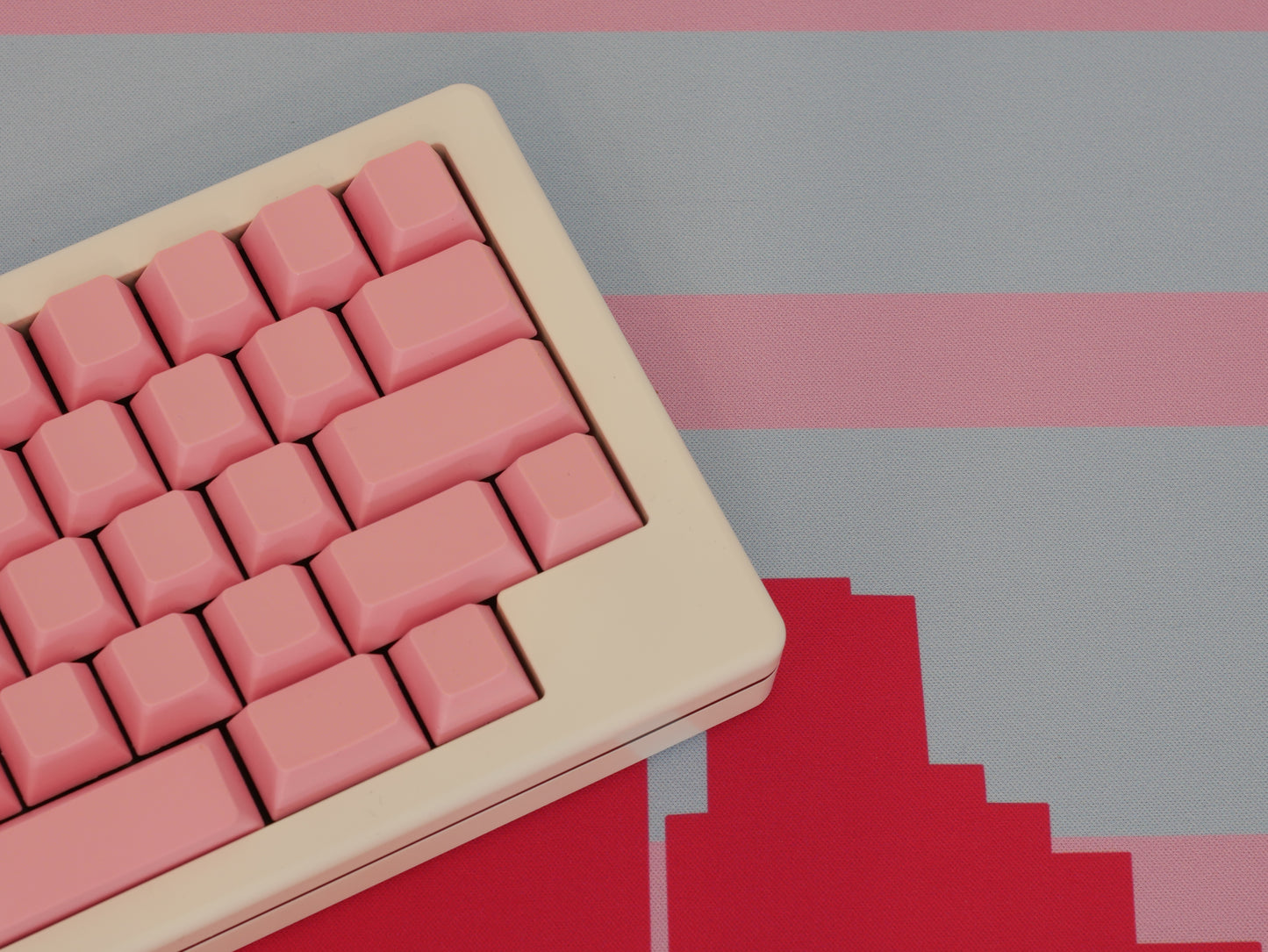 A closer view of the middle of the pink and blue Miami skyline desk mat.