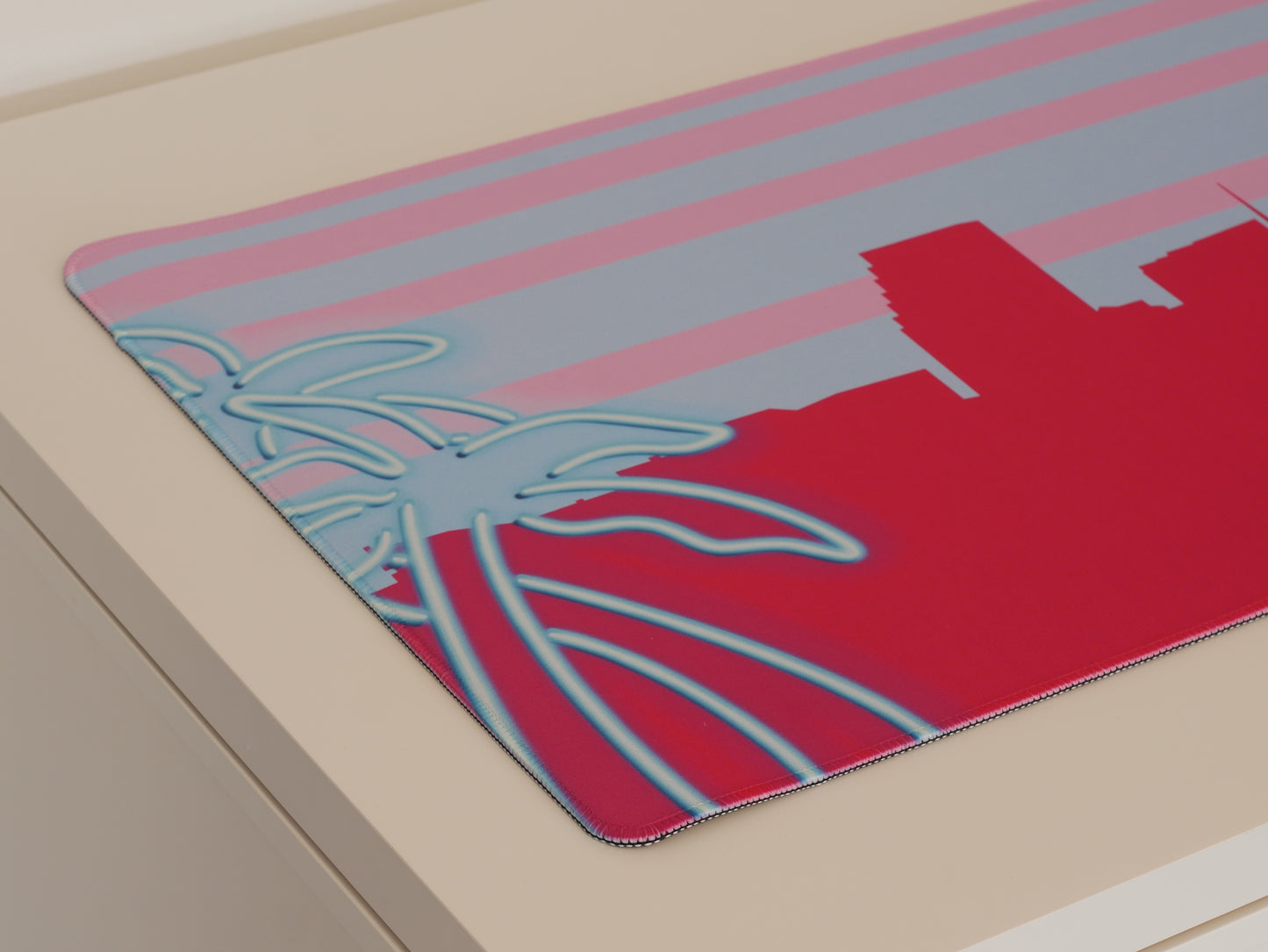 Left side of the pink and blue Miami skyline desk mat.