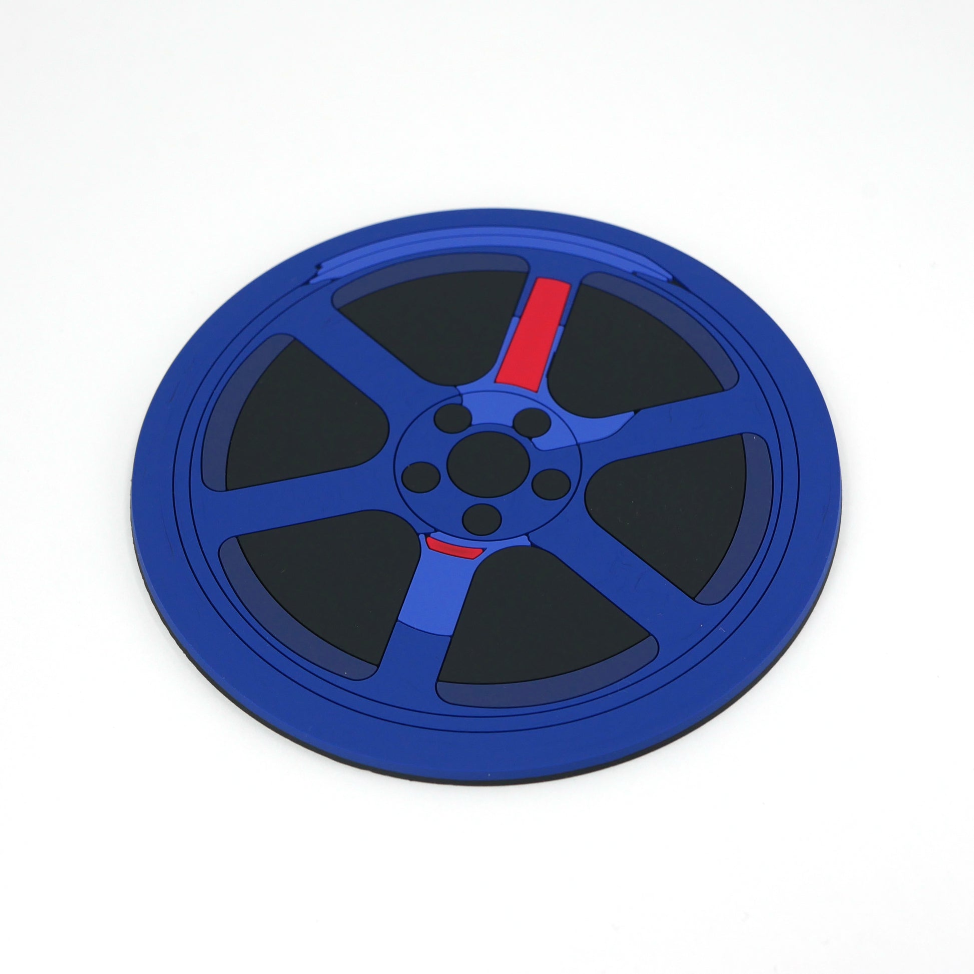 The side of a blue TE wheel PVC rubber coaster.