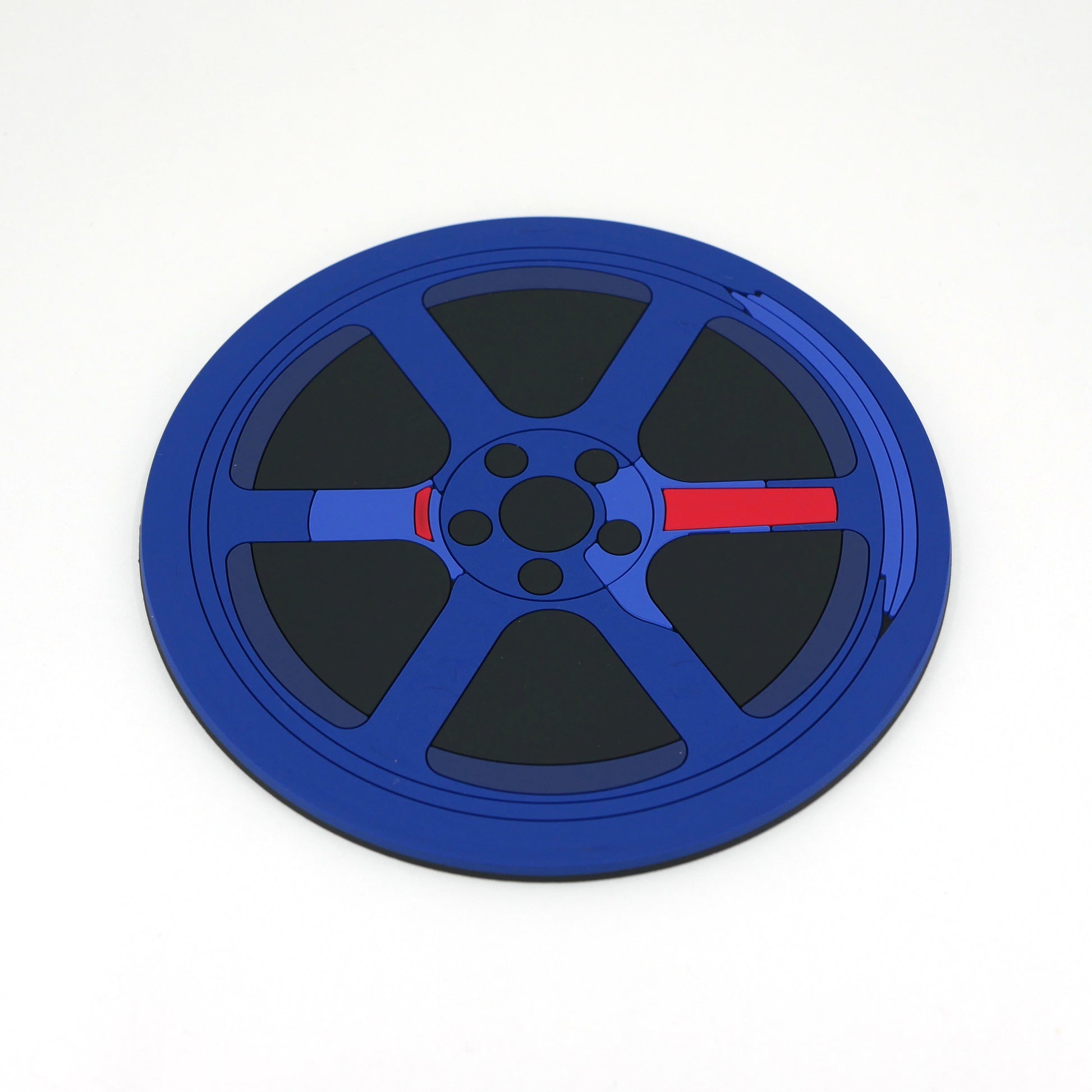 The front of a blue TE wheel PVC rubber coaster.