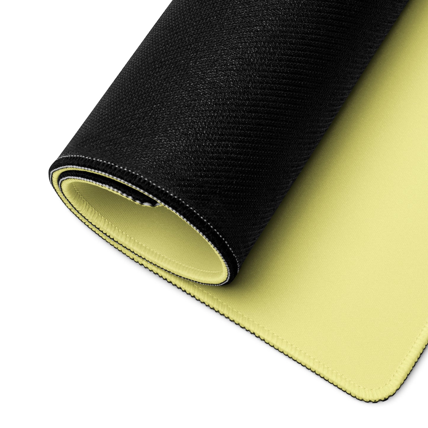 A yellow gaming desk pad rolled up.